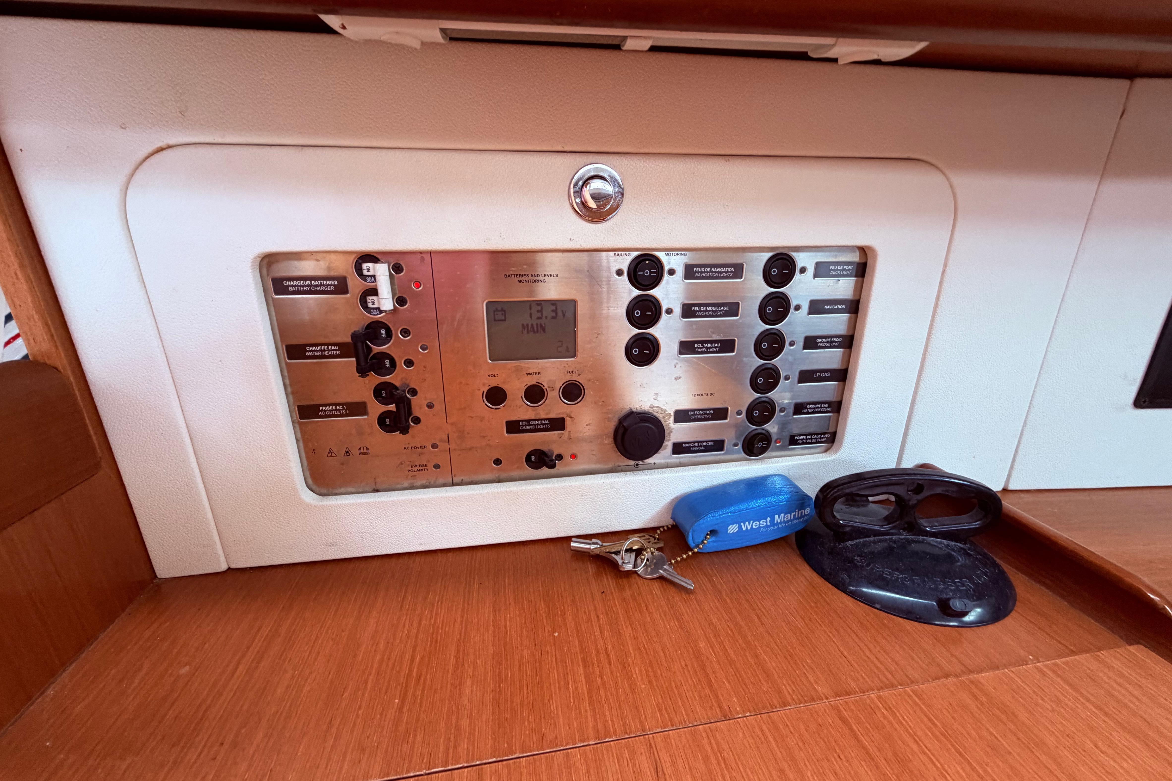 Control panel of a 2009 Beneteau Oceanis 40 yacht with keys and accessories.