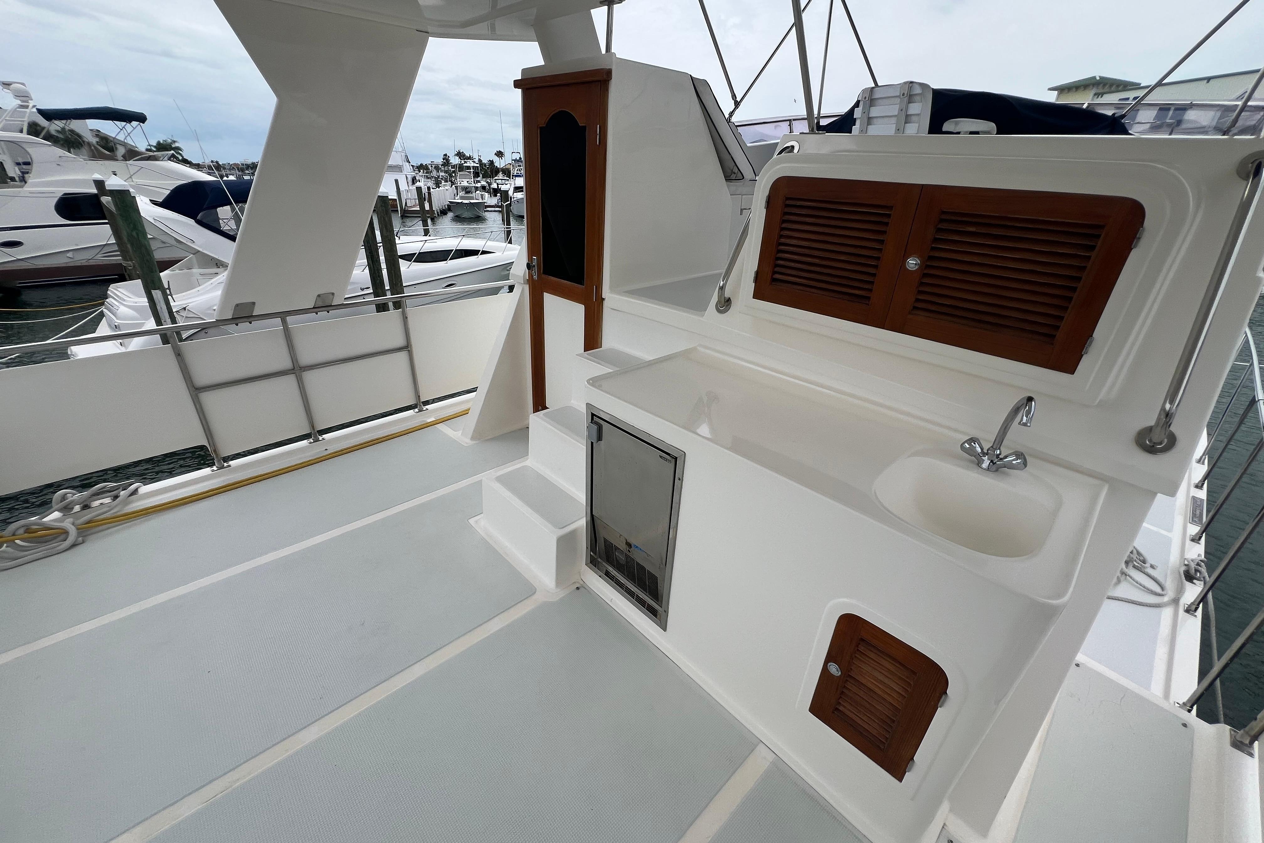 2007 Heritage East 36 Sundeck Trawler with outdoor sink and storage on deck.