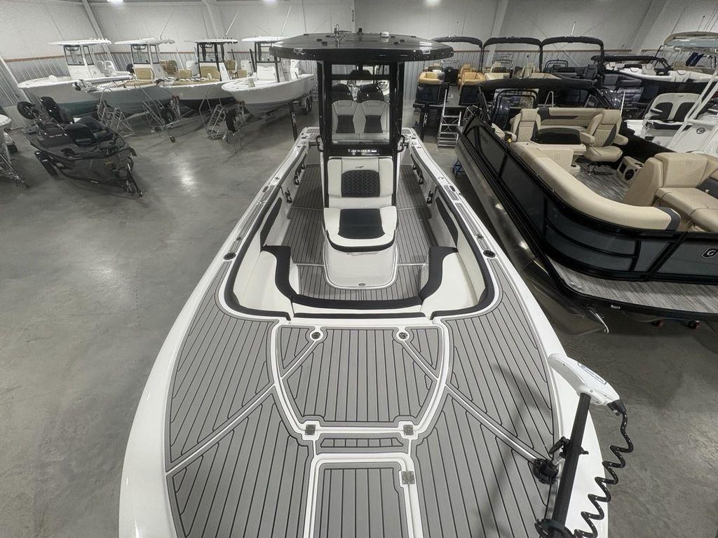 2026 Tidewater 2700 CB boat in showroom, featuring sleek design and spacious deck.