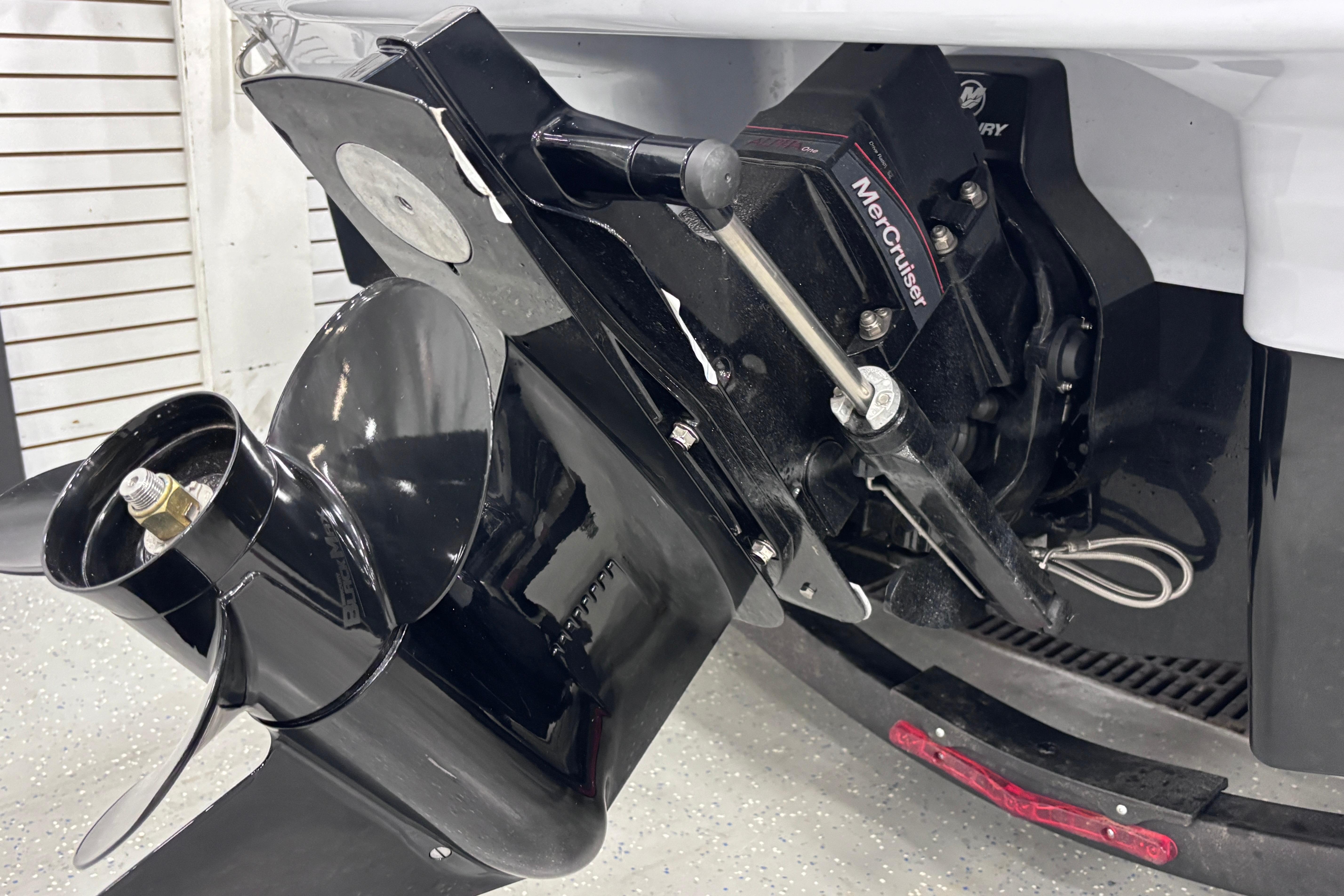 2026 Chaparral 21 SSi boat with MerCruiser engine and propeller detail.