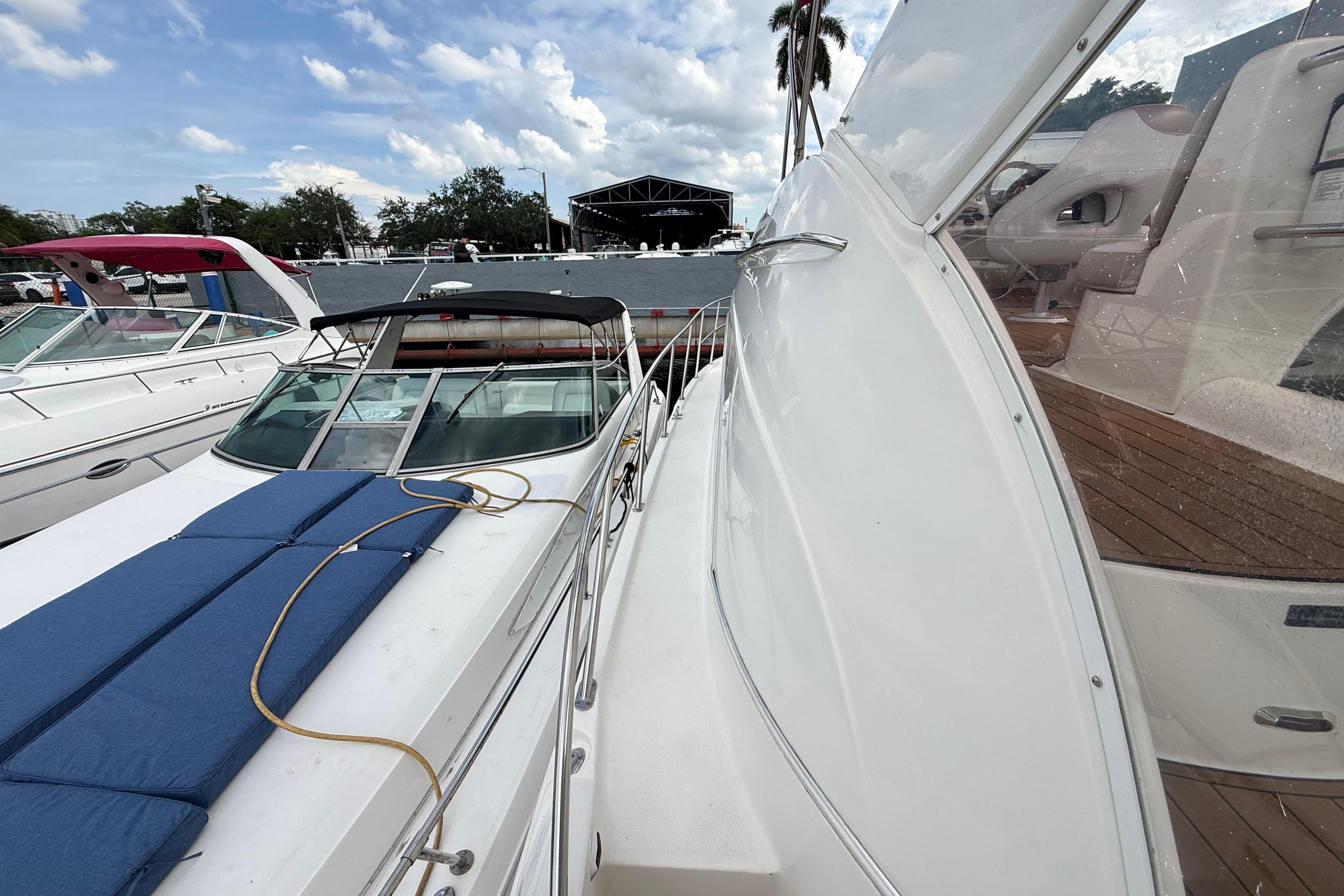 2007 Meridian 459 Motoryacht docked, showcasing sleek design and spacious deck under a cloudy sky.