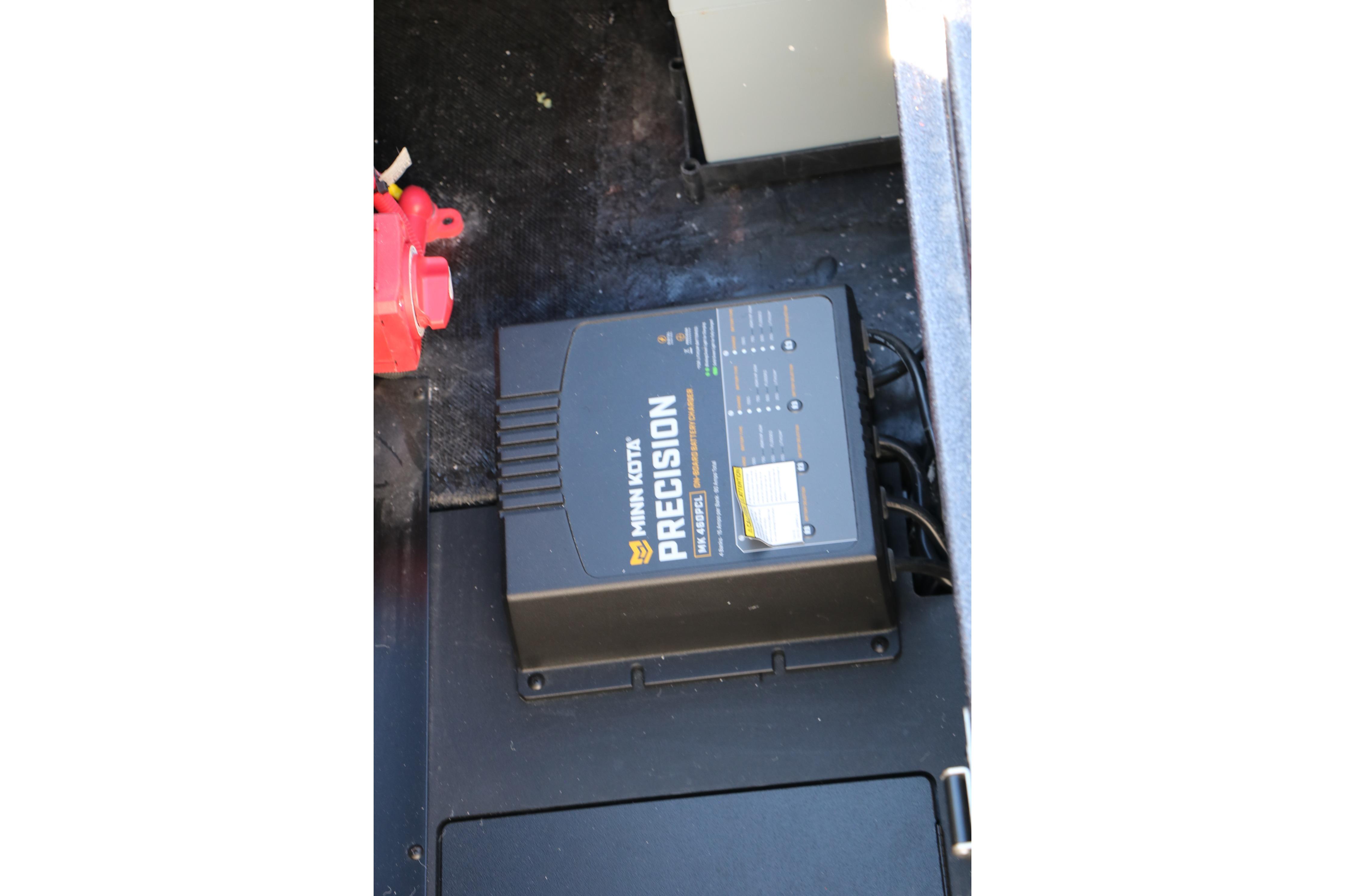 Minn Kota Precision charger in 2027 Caymas 201 Pro boat compartment.
