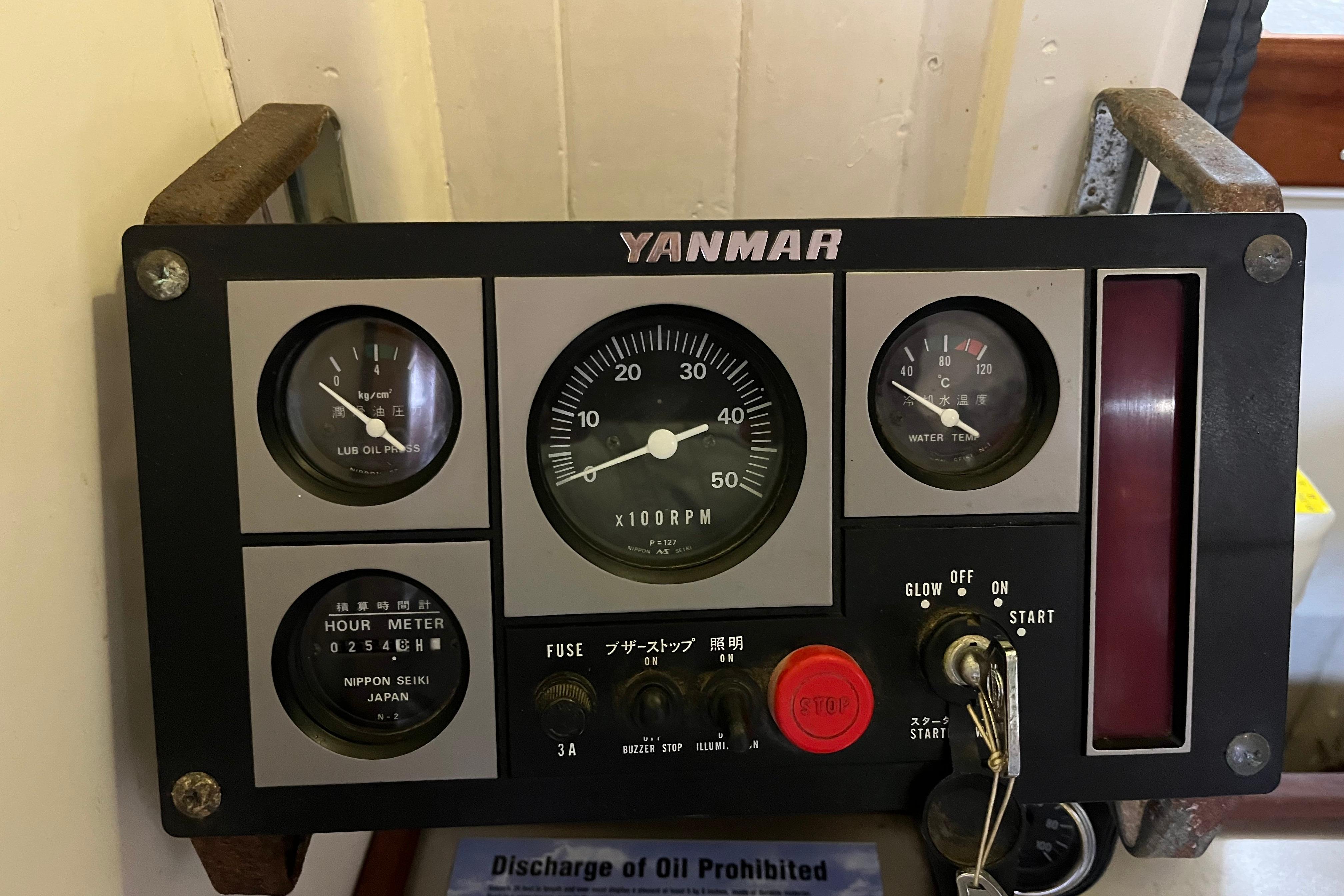 Yanmar engine control panel on 1947 Murray Peterson Schooner, displaying gauges and switches.