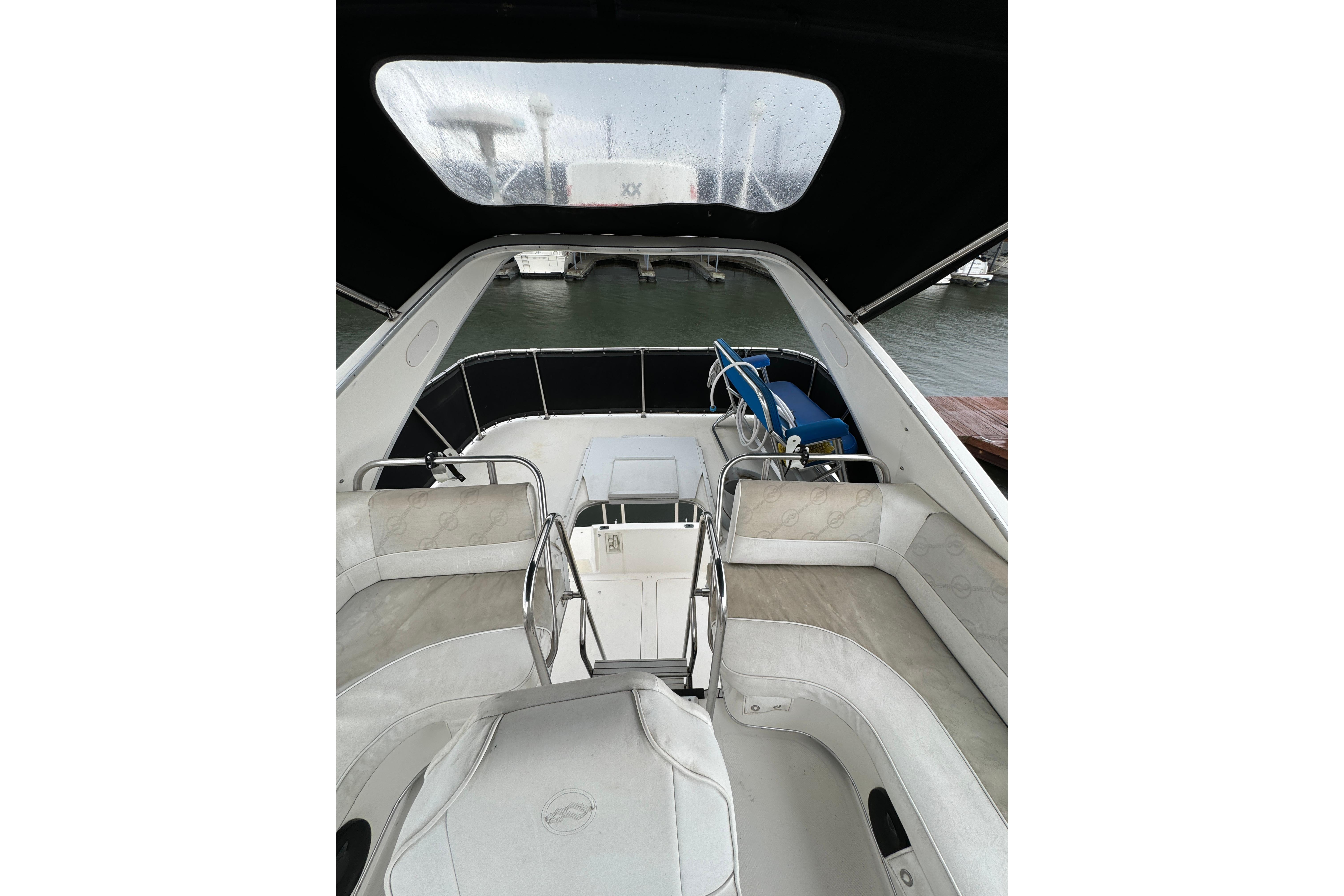1996 Bayliner 3388 Command Bridge Motoryacht interior with seating and water view.