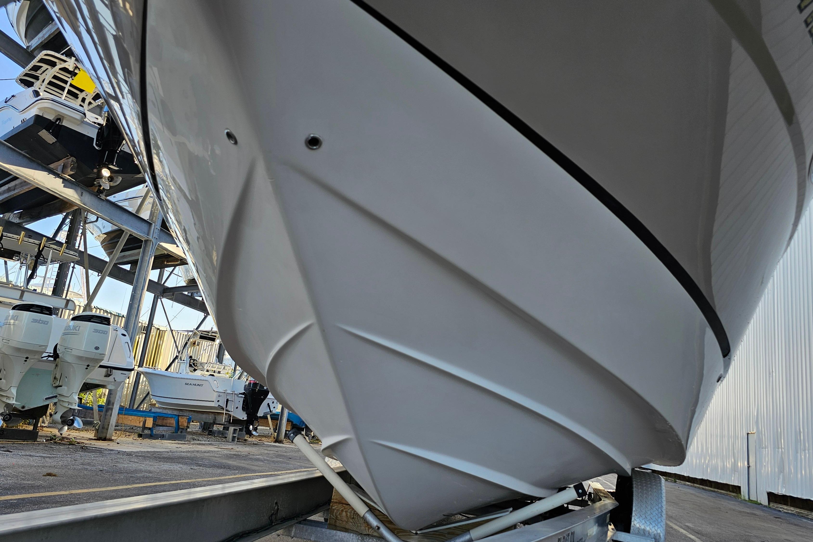2005 Regal 3060 Window Express boat on trailer in storage facility.