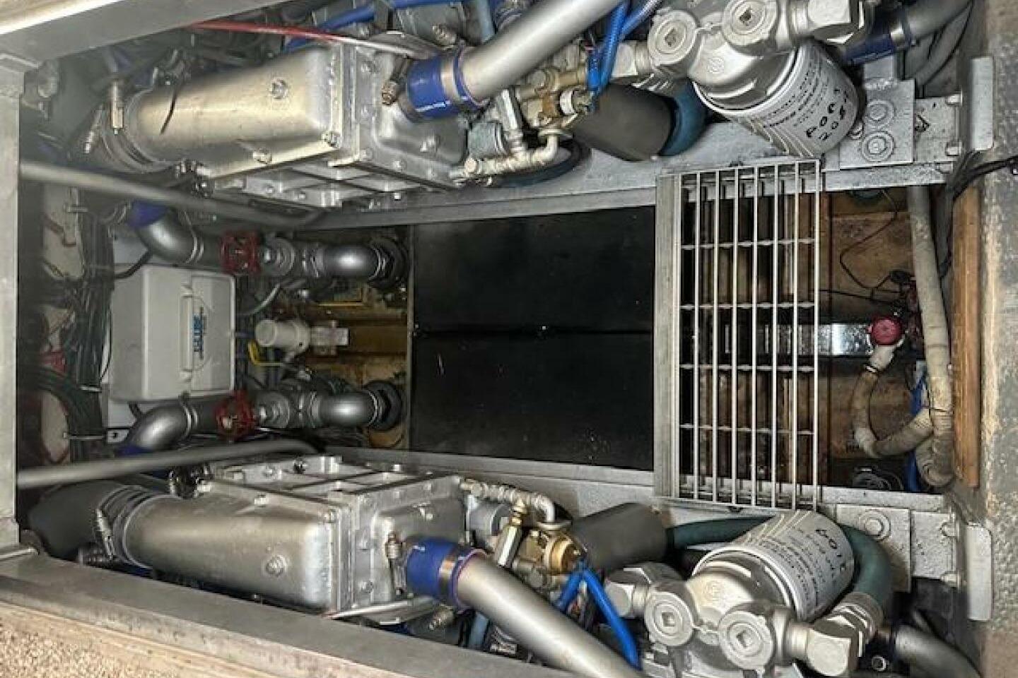 Engine room of a 1989 Viking 41 Sportfish Convertible boat, showcasing mechanical components.