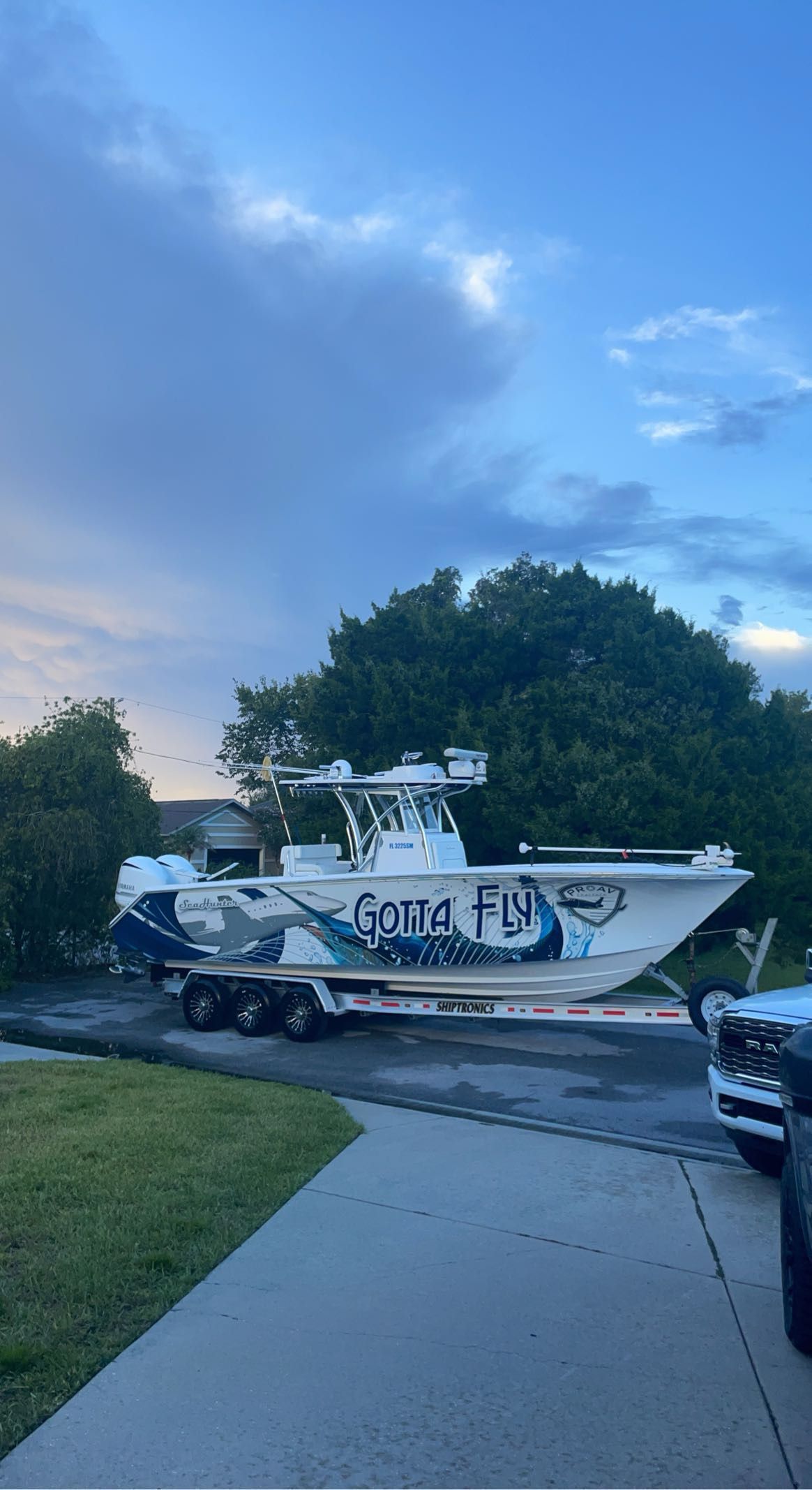 2019 SeaHunter 31 Tournament boat on trailer outdoors.
