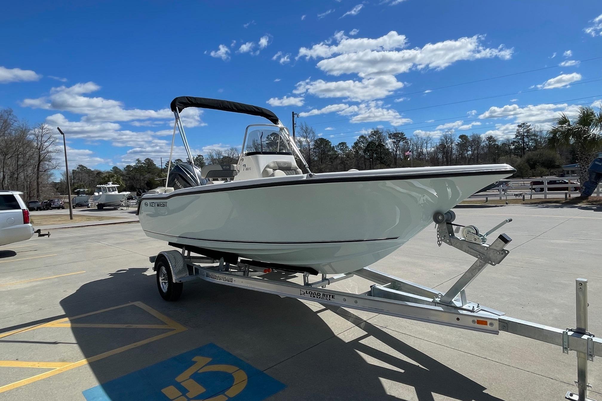 2026 Key West 203 FS boat on trailer under blue sky.