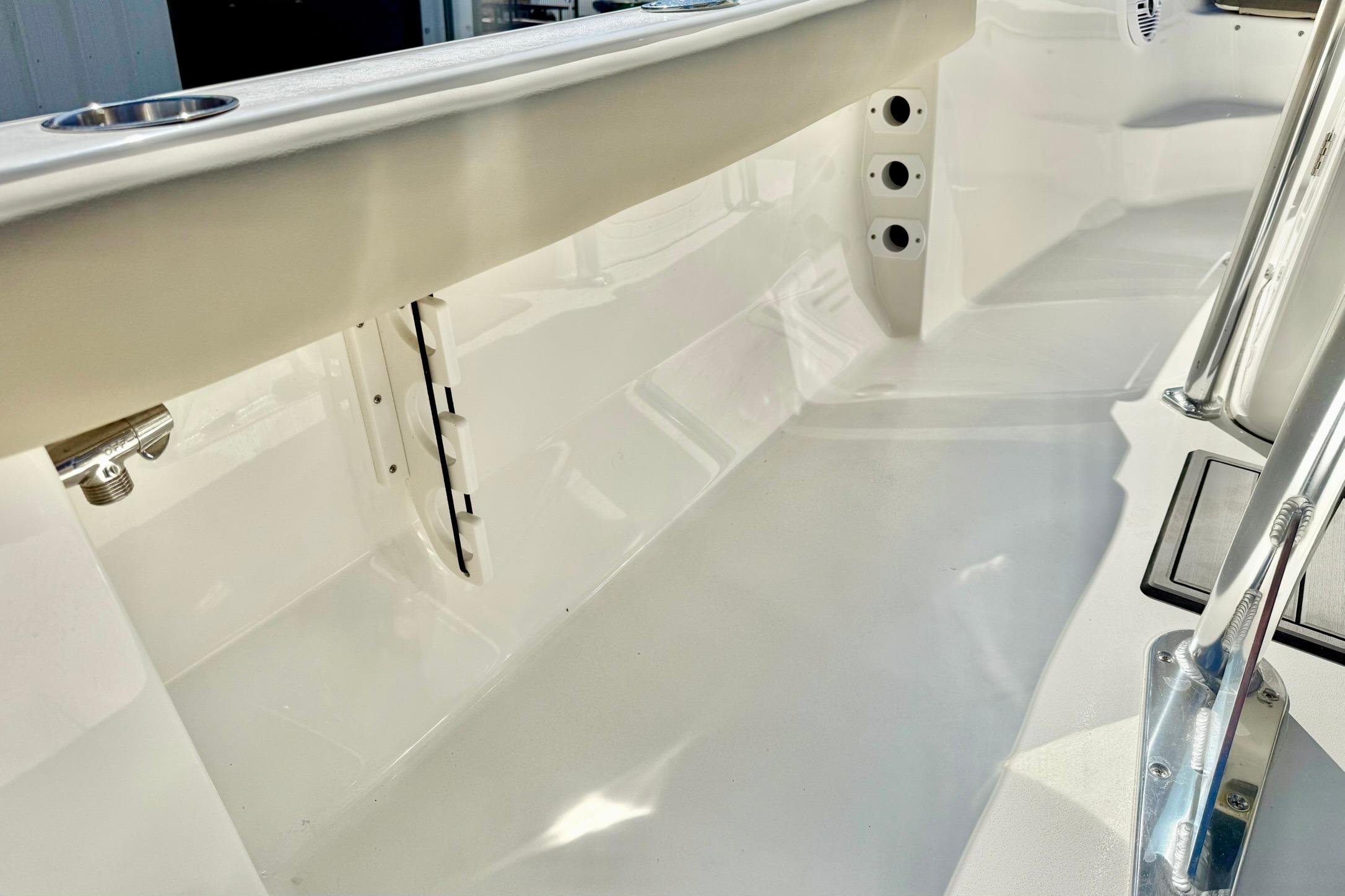 2026 Key West 189 FS boat interior, showcasing sleek white design and stainless steel fittings.