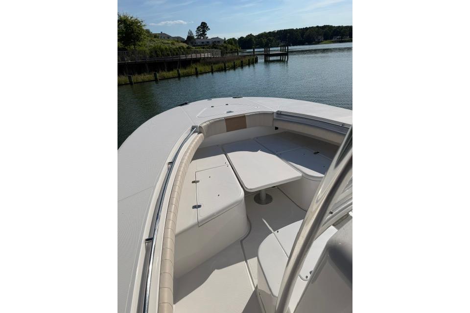 2014 Southport 29 FE boat with spacious seating on calm water.