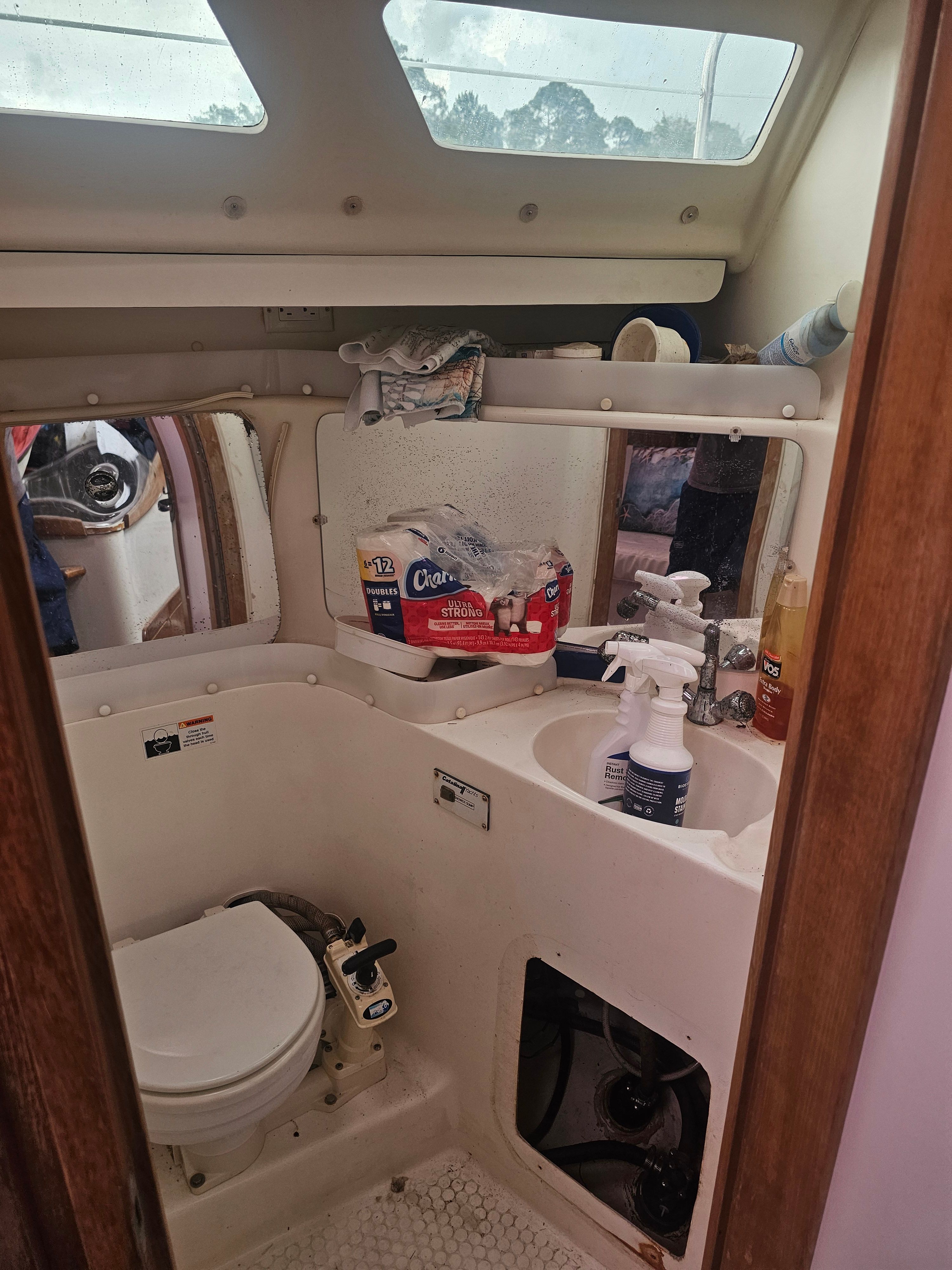 Interior view of a 2006 Catalina 320 boat bathroom.