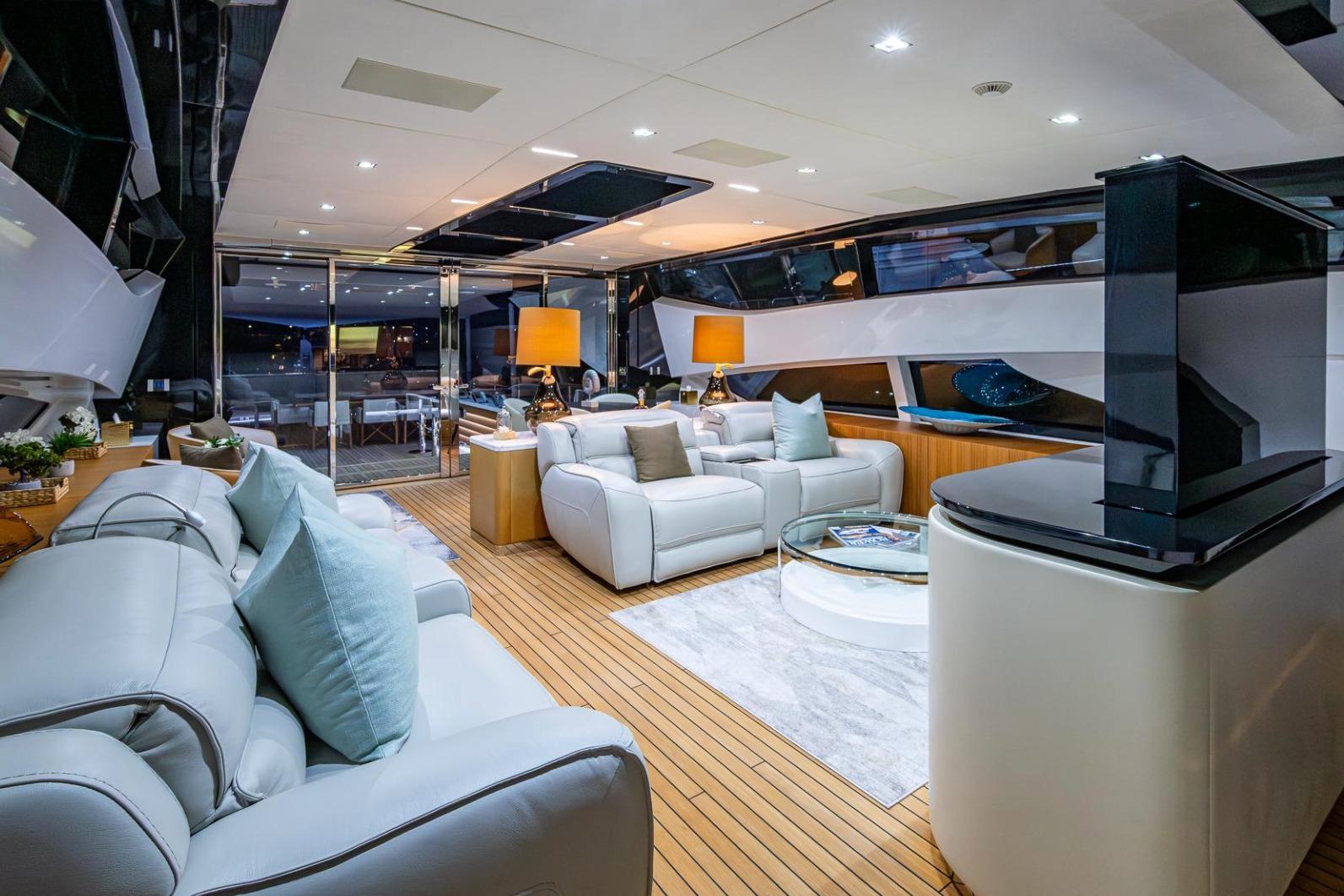 Luxurious interior of 2020 Overmarine Gransport 54 yacht with elegant seating and modern decor.