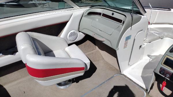 1999 Chaparral 2130 SS boat interior with white and red seating.