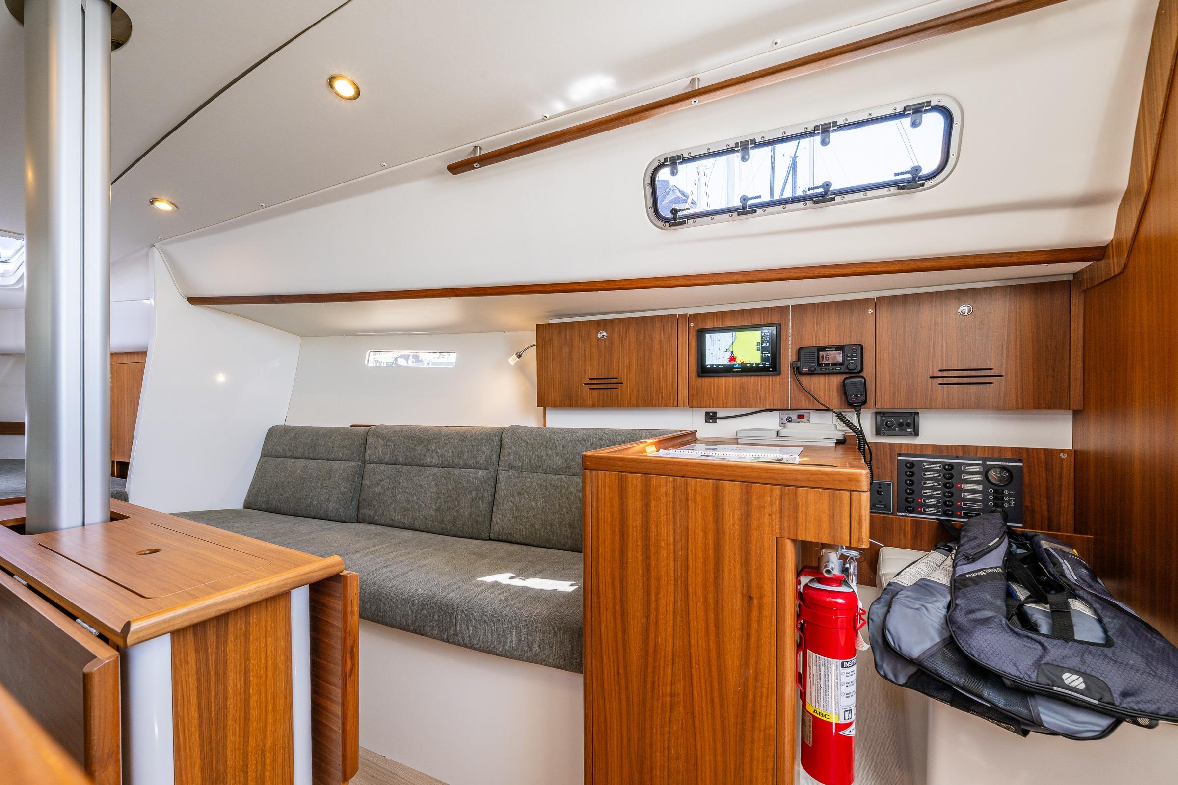 Interior of 2018 J Boats J/97E sailboat with modern wood finish and navigation equipment.