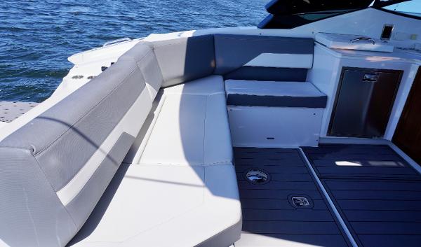 2020 Cruisers Yachts 38 GLS OB interior with sleek seating and modern design on open water.