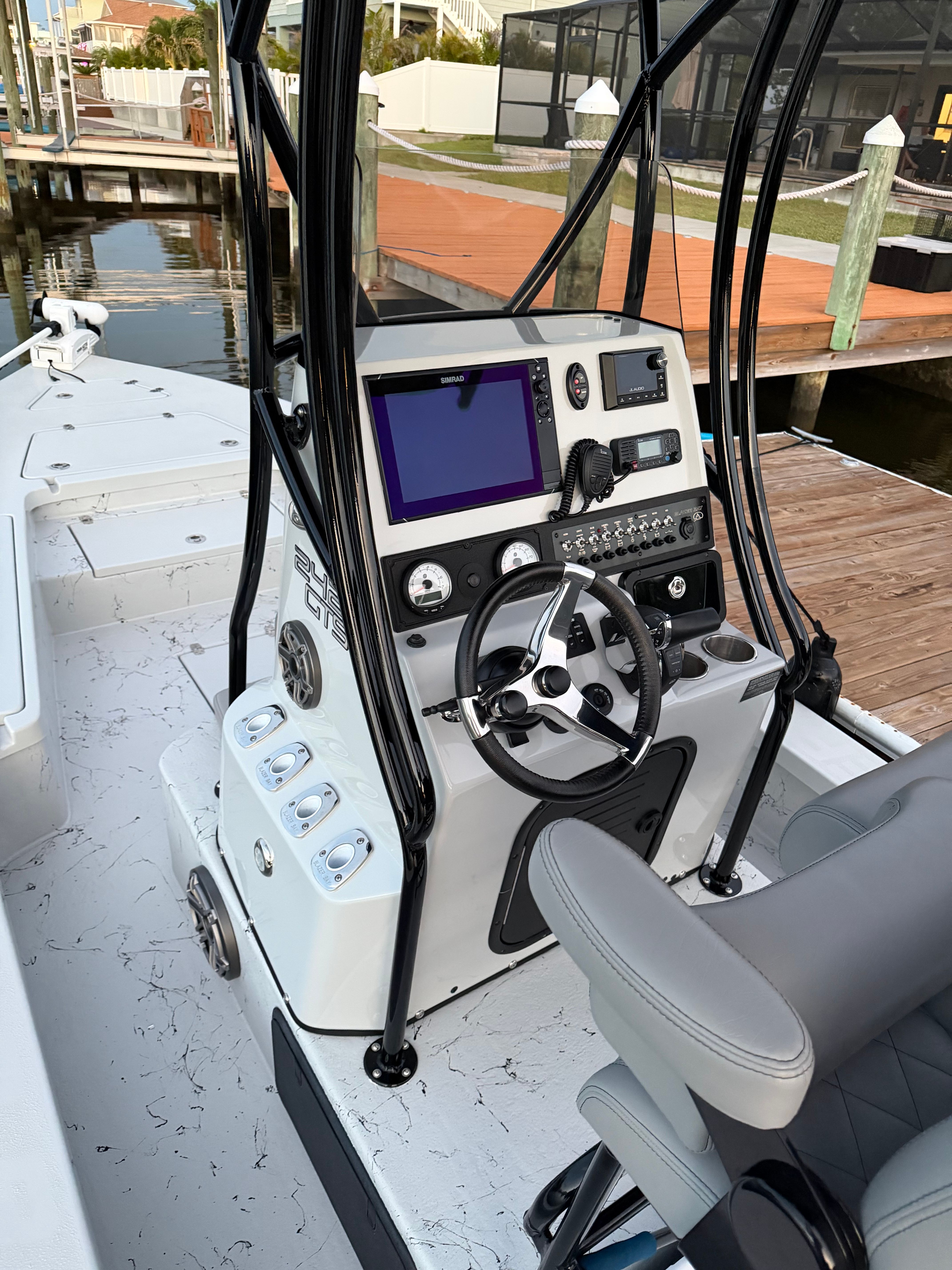 The image shows the cockpit of a 2022 Blazer Bay 2420 GTS with modern electronics and controls.