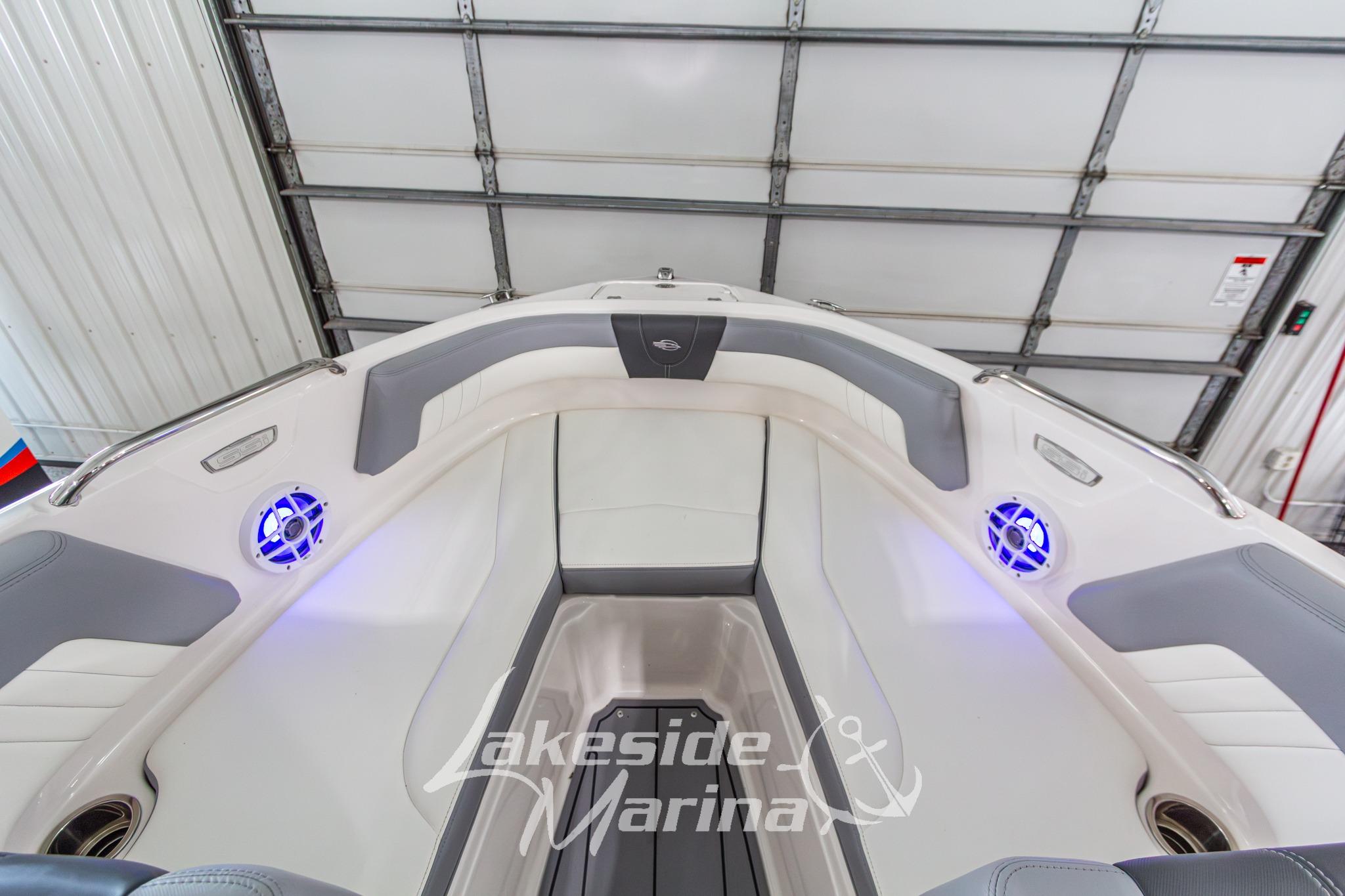 2022 Chaparral 21 SSi boat interior with gray seating and blue LED lights.