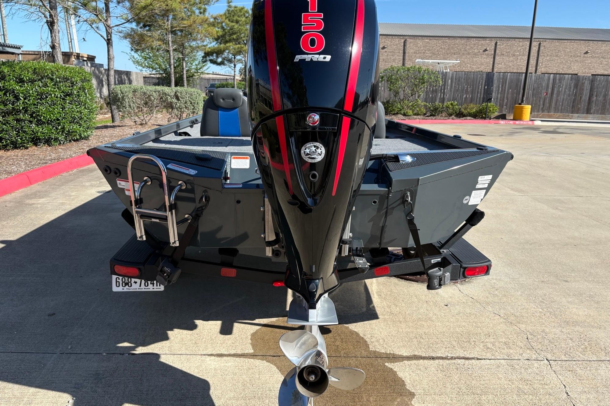 2024 Ranger RT198P boat with powerful 150 Pro motor, parked outdoors.