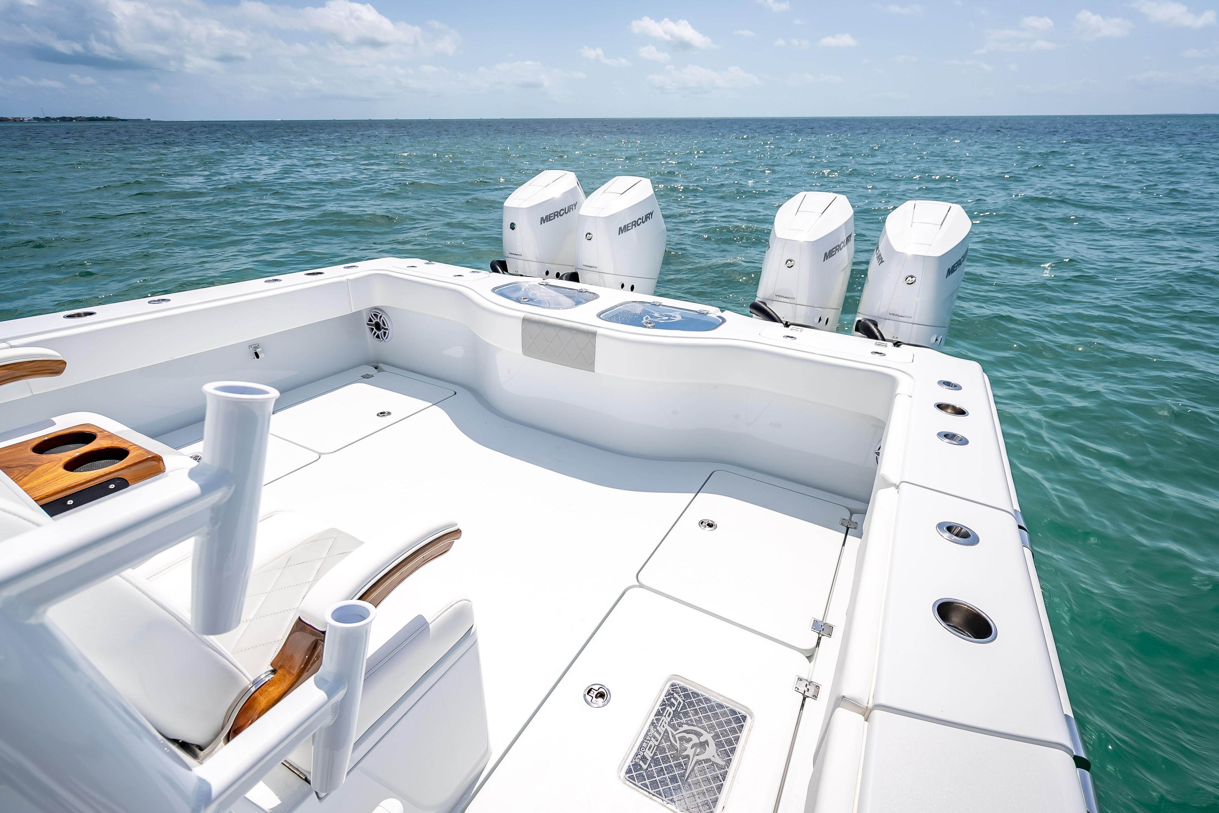 2025 Freeman 43 boat with four Mercury engines on open sea.
