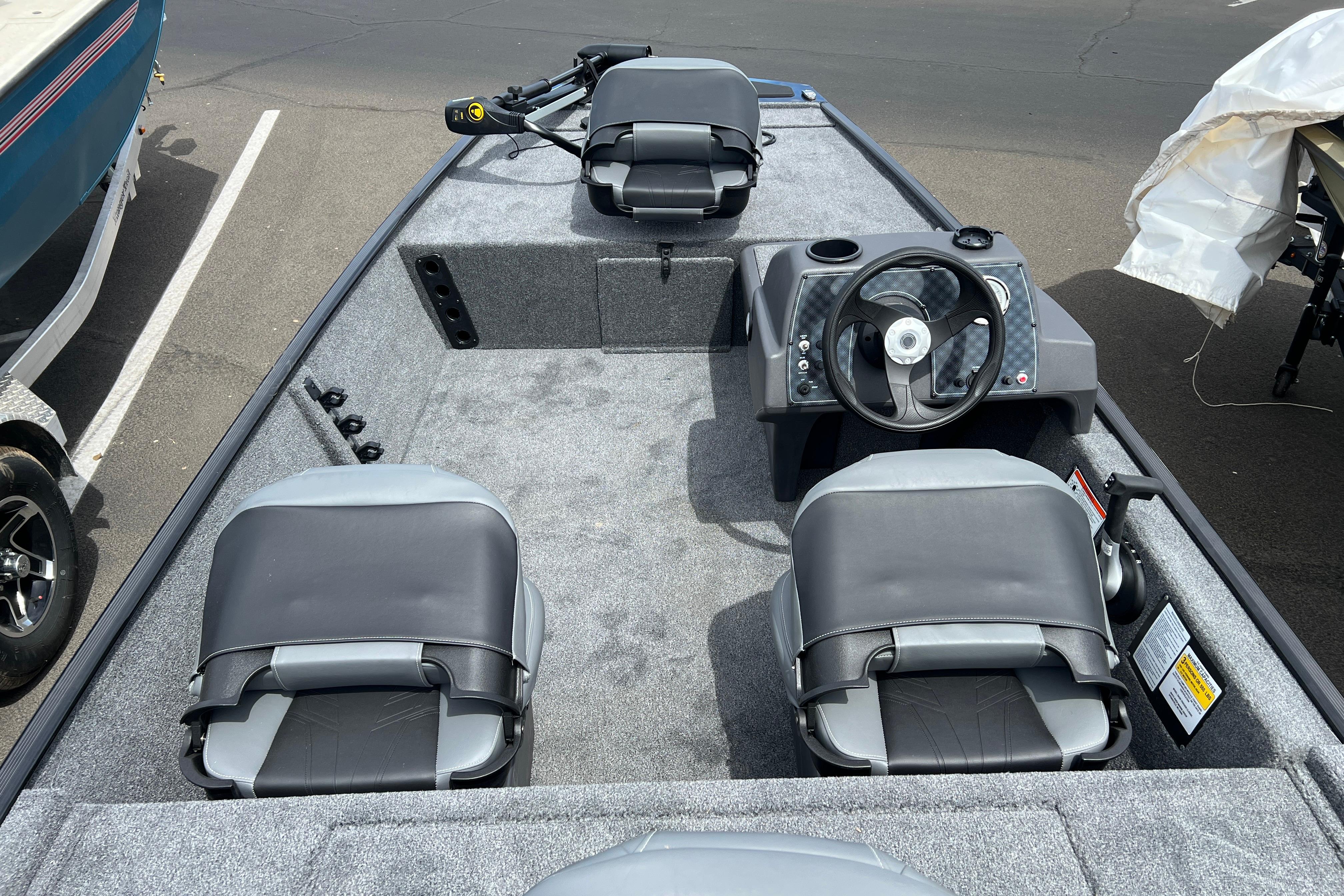 2026 Tracker Bass Tracker Classic XL boat interior with steering wheel and seating.