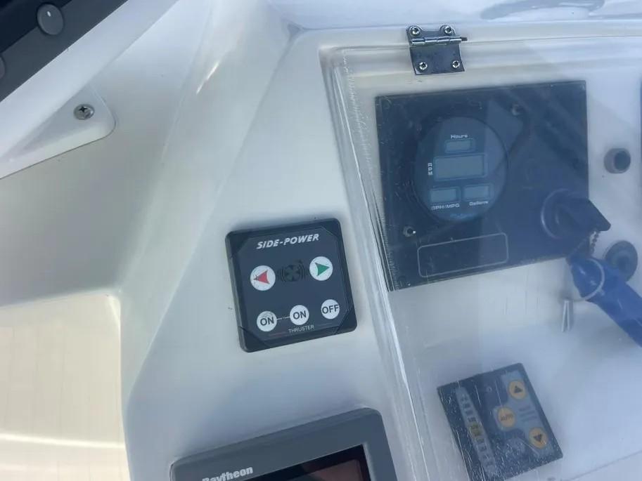 Control panel of a 1985 Princess Sedan Flybridge boat with navigation instruments.