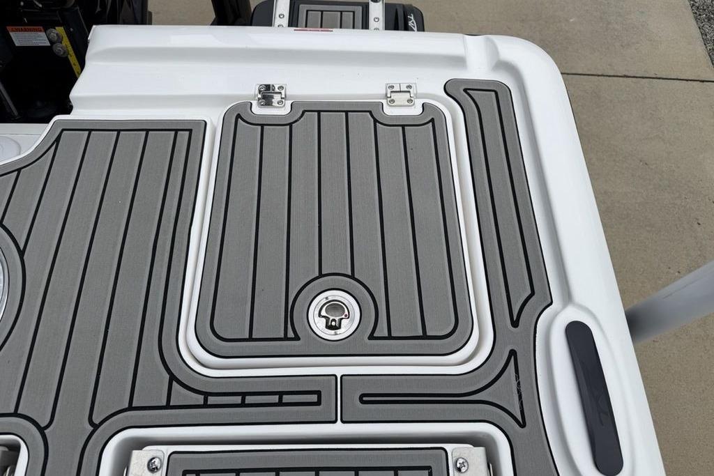 2026 Tidewater 2500 Carolina Bay boat deck with sleek, modern design and secure latch system.