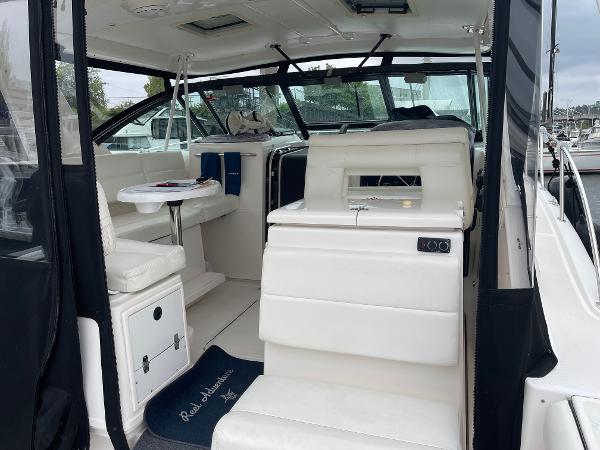 2003 Tiara Yachts 3500 Open interior with white seating and helm station.