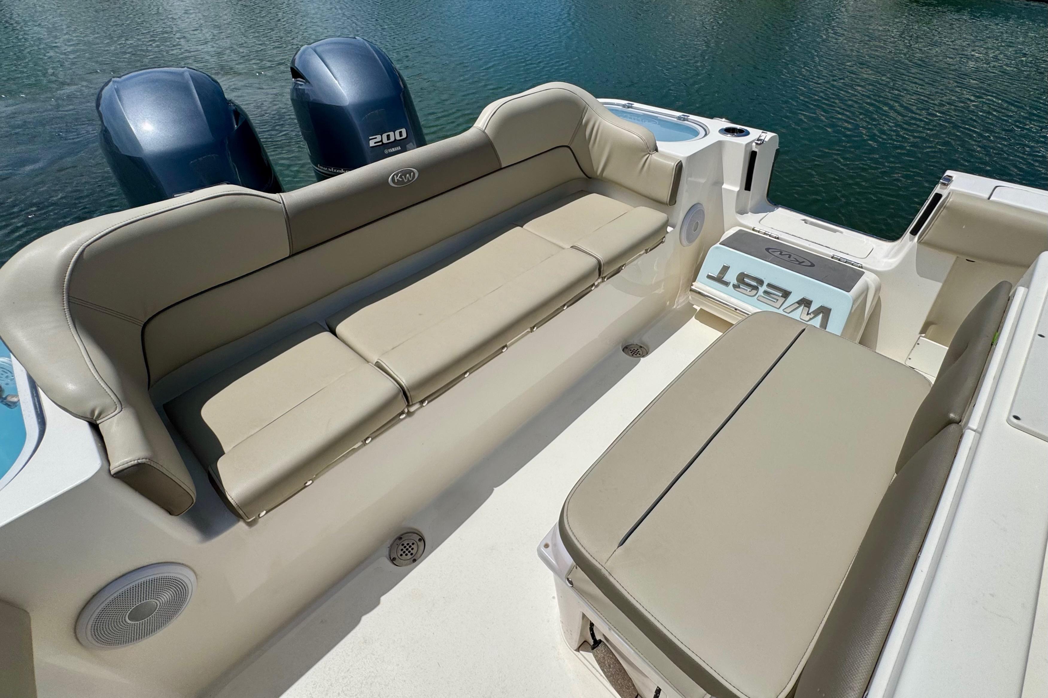 2022 Key West 263 FS boat interior with beige seating and twin 200 engines.