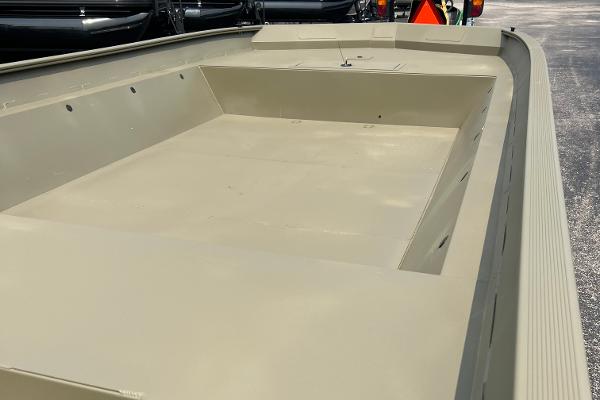 2025 Tracker GRIZZLY 2072 Utility boat, spacious interior, beige color, parked outdoors.