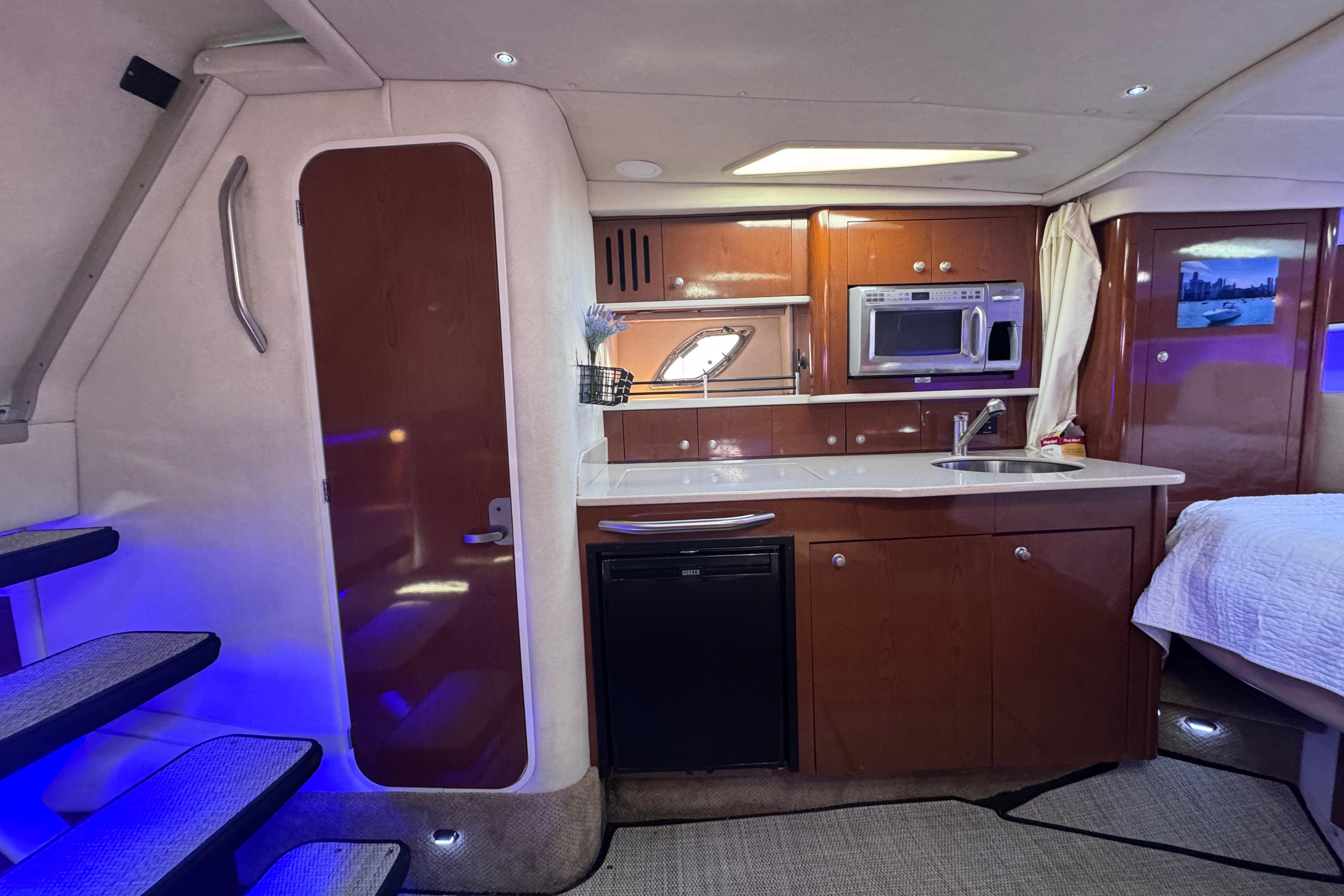 Interior of 2008 Sea Ray 350 Sundancer yacht with kitchenette and modern amenities.