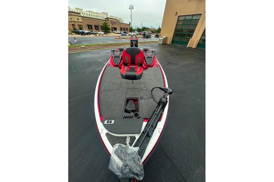 2026 Nitro Z19 XL boat with red and black seating, parked outdoors.