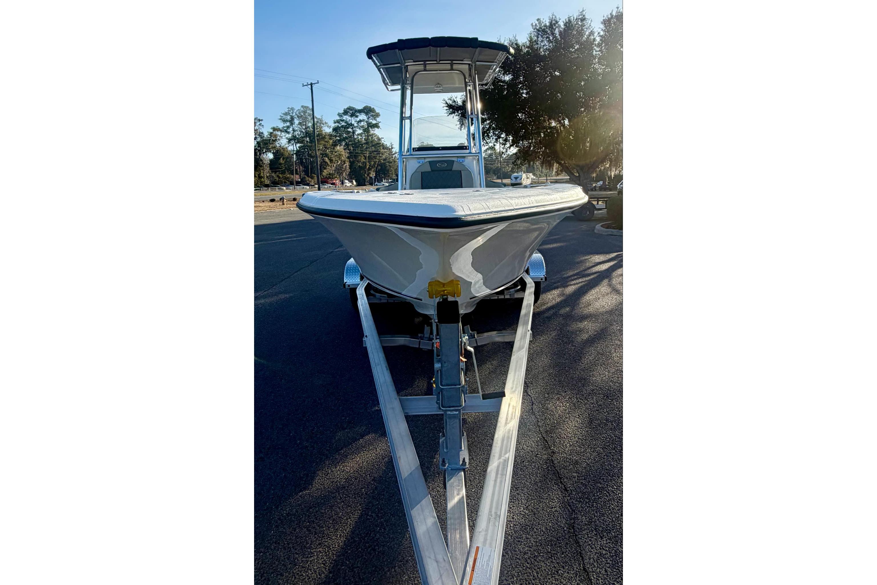 2026 Key West 203 FS boat on trailer, parked outdoors, front view.