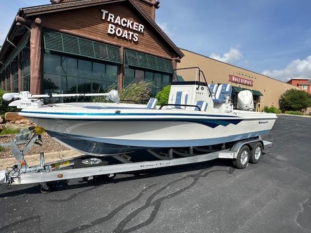 2025 Ranger 2360 Bay boat on trailer outside Tracker Boats store.