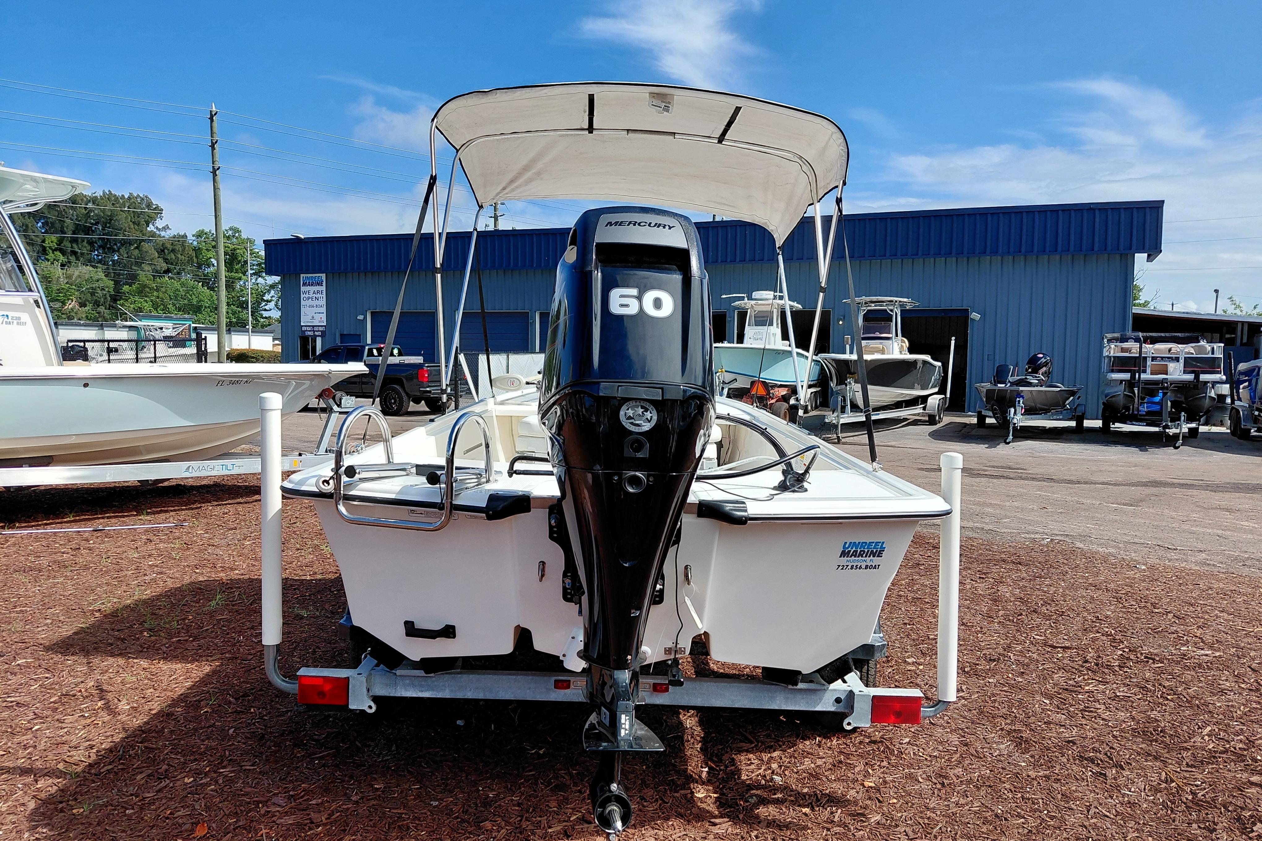 2015 Mako Pro Skiff 17 CC with Mercury 60 engine at a boat dealership.
