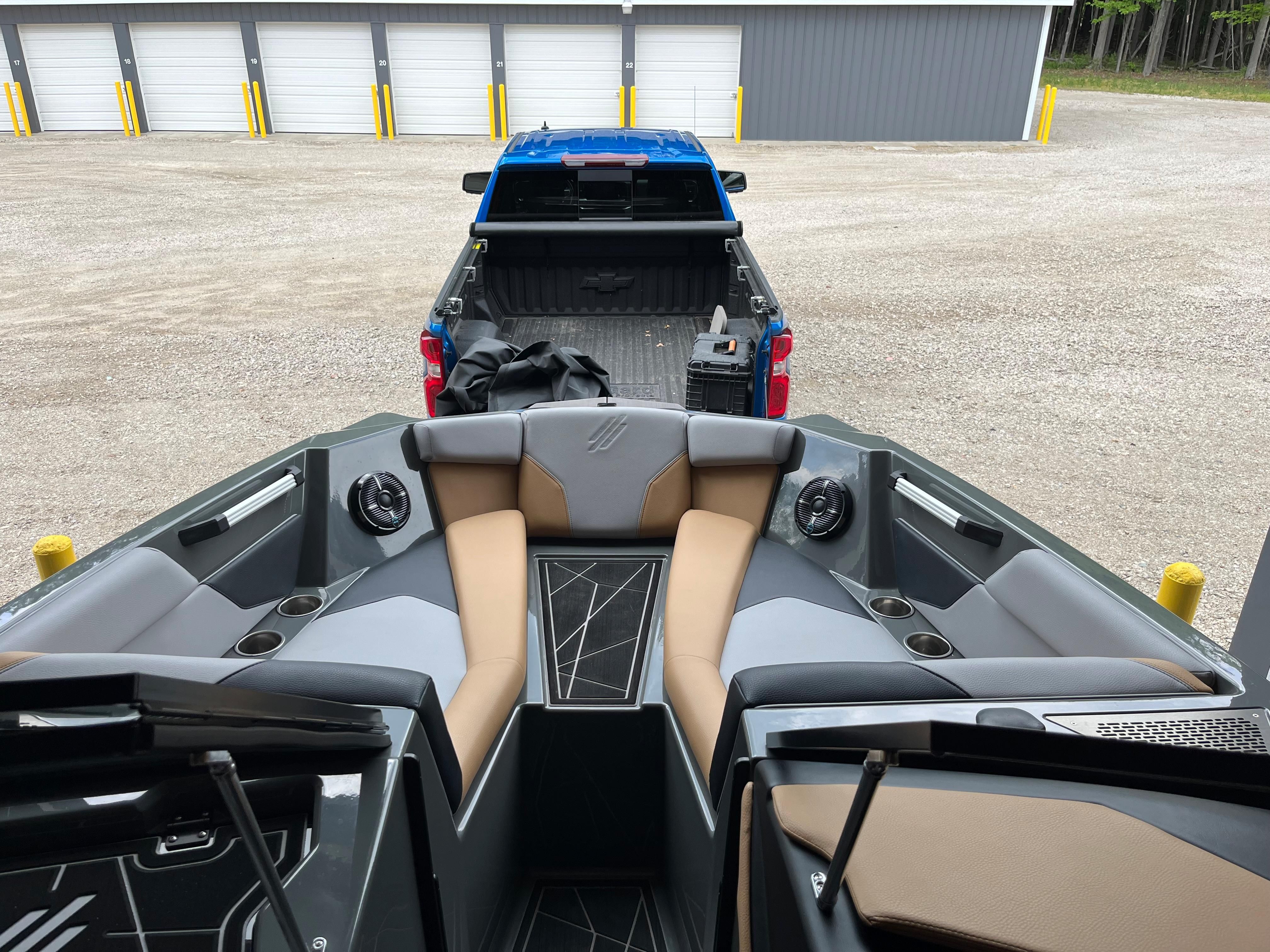 The image shows the interior of a 2022 ATX Surf Boats 22 Type-S on a trailer.
