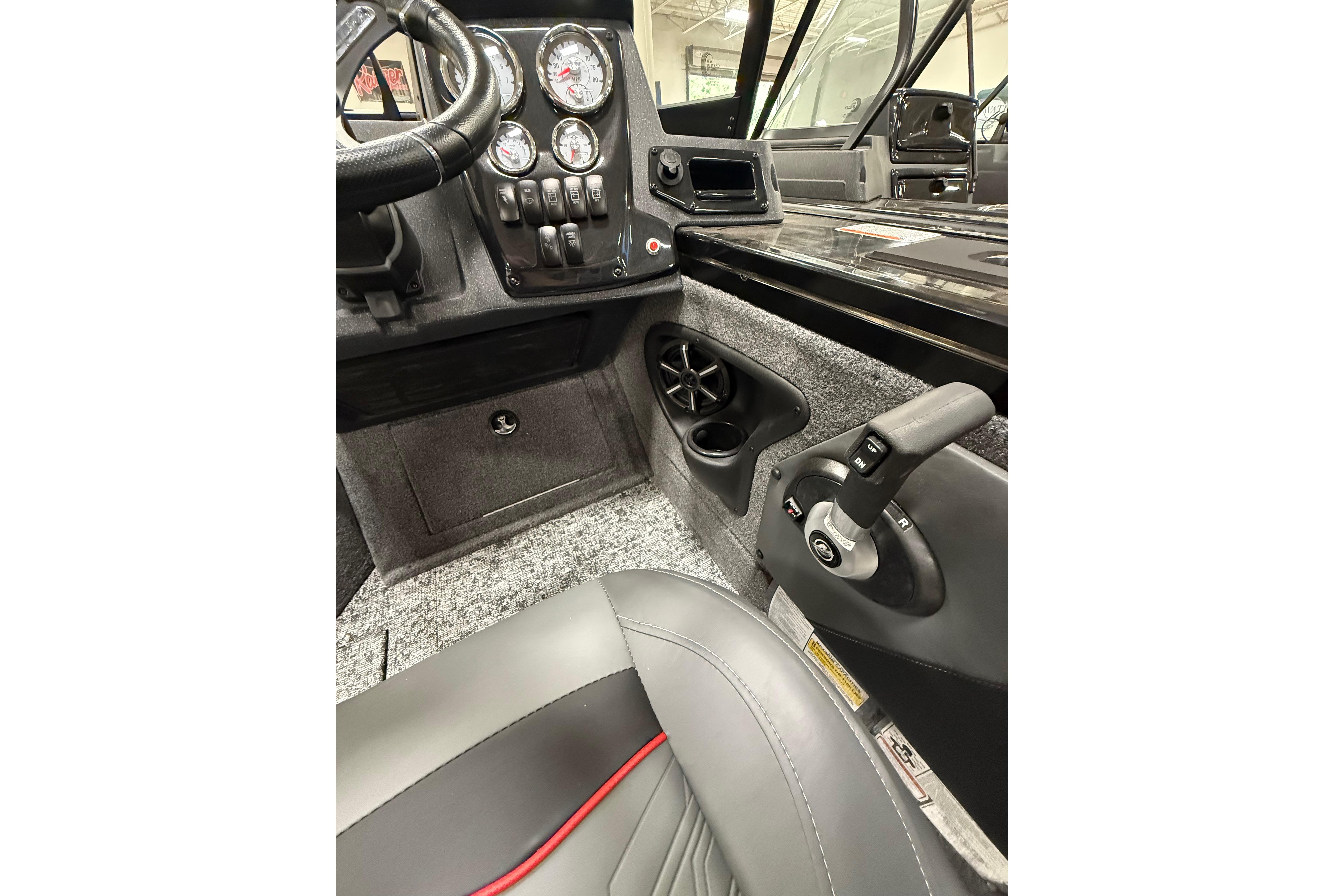 Interior of 2026 Tracker Targa V-19 WT boat, featuring control panel and steering.