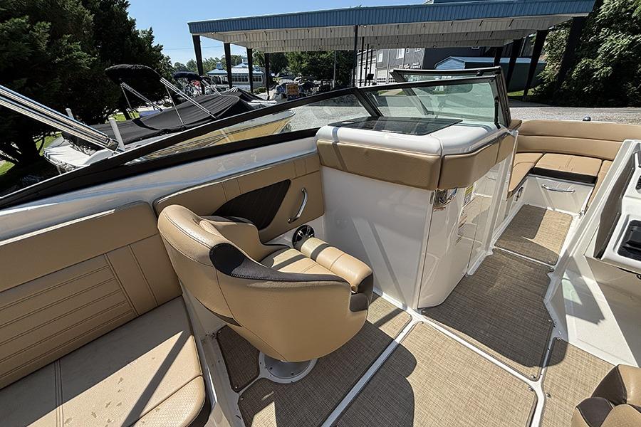 2019 Sea Ray SPX 230 Outboard interior with tan seating and helm.