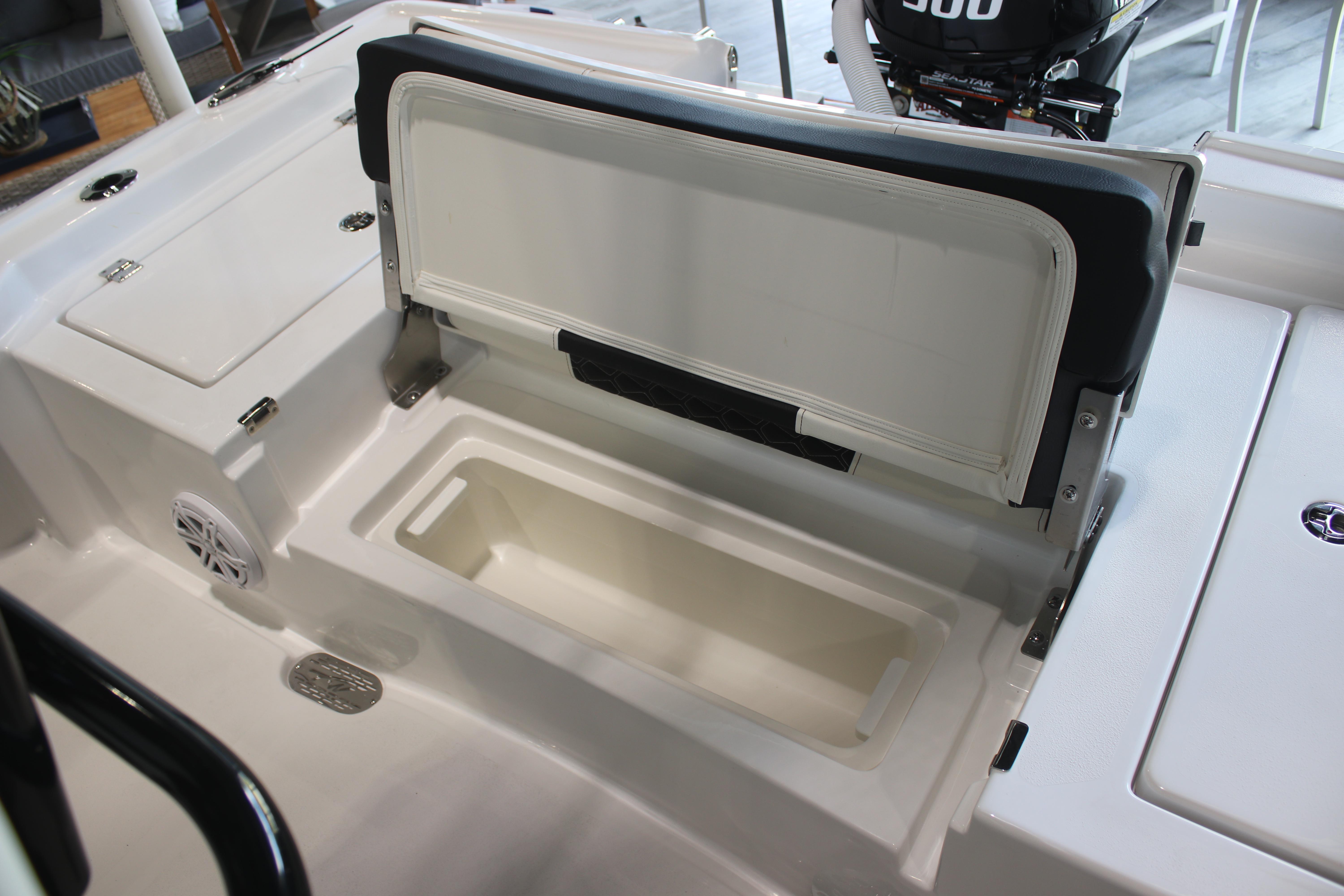 2026 Tidewater 2300 Carolina Bay boat with open storage compartment and seating.