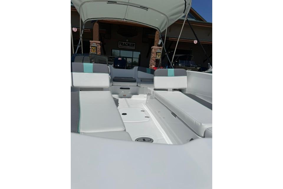 2026 Tahoe T18 boat interior with cushioned seating and canopy.