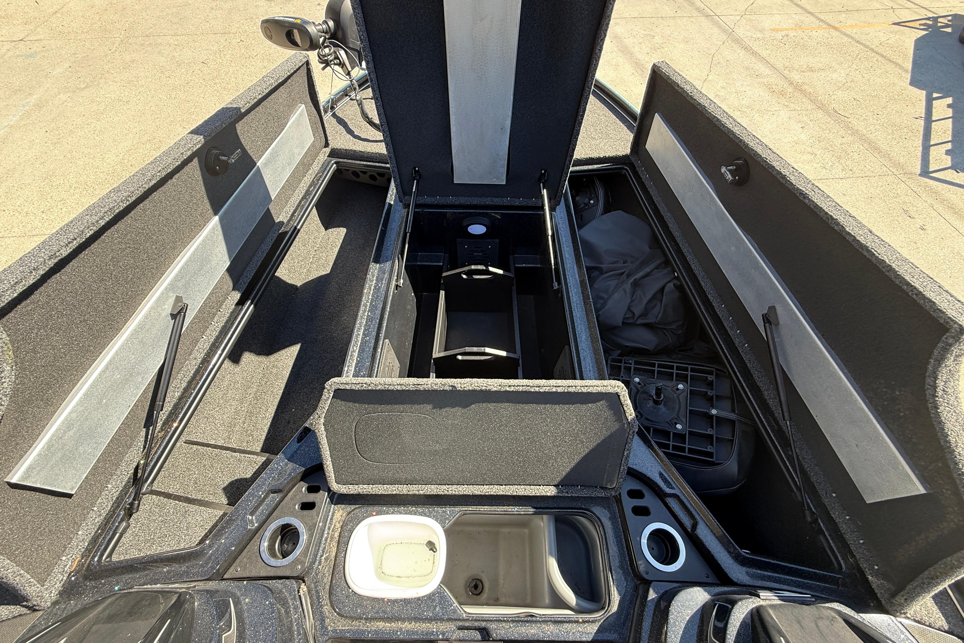 2020 Nitro Z20 boat interior with open storage compartments and fishing gear.