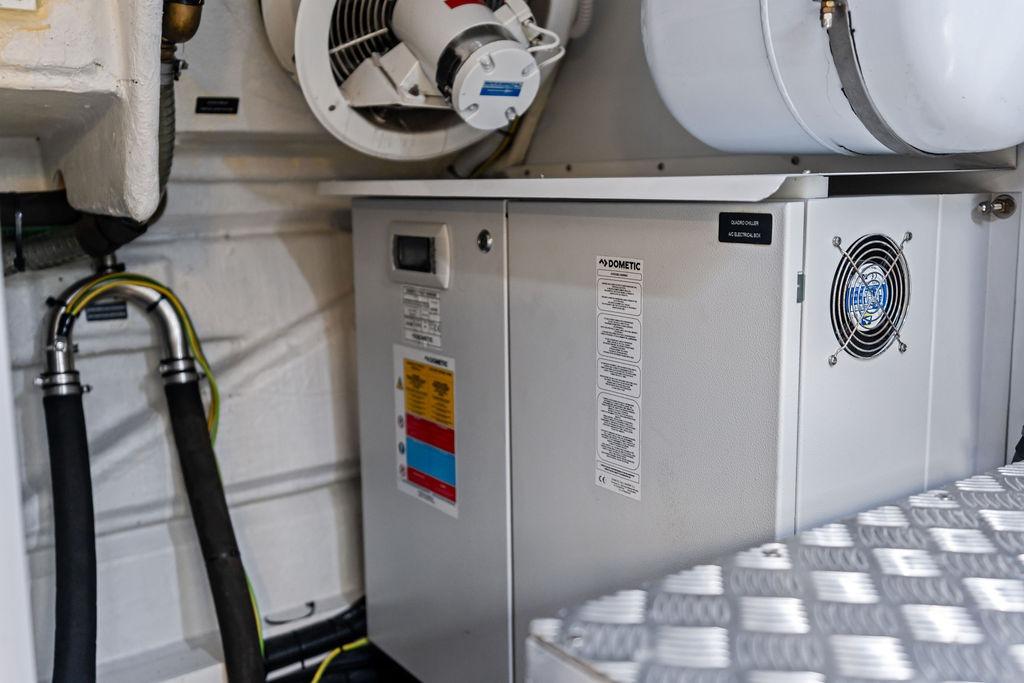 Engine room of 2025 Pershing GTX 80 yacht with Dometic equipment and ventilation system.