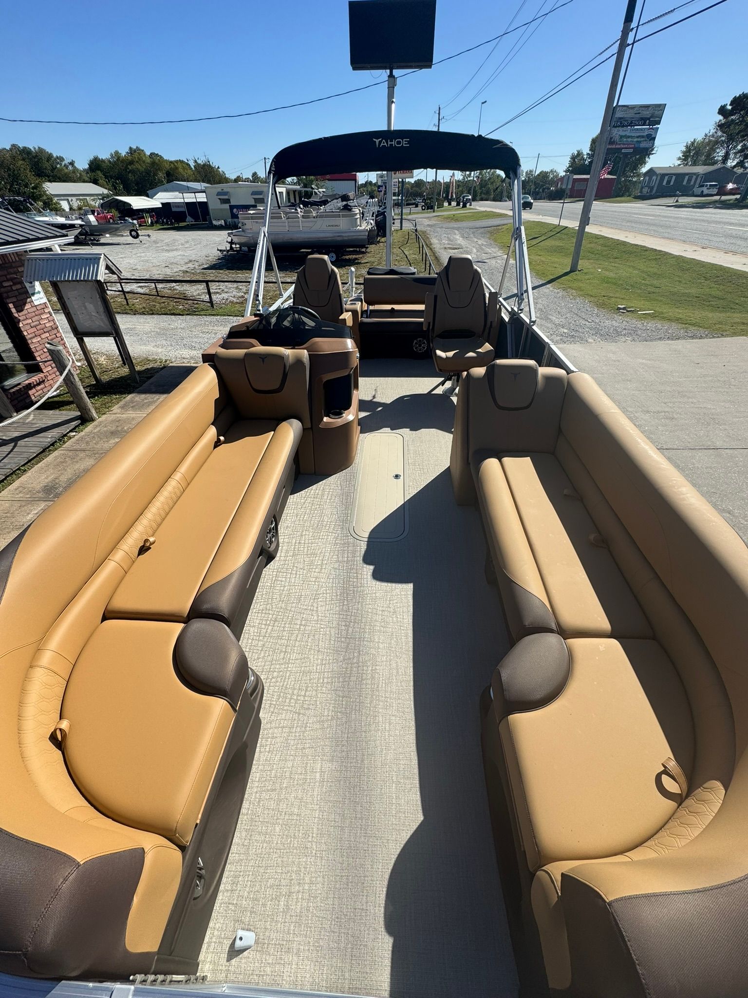 Interior of 2025 Tahoe 2585 LTZ VRB pontoon boat with brown seating.