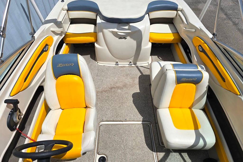 Interior of a 2007 Sea Ray 205 Sport boat with yellow and white seating.