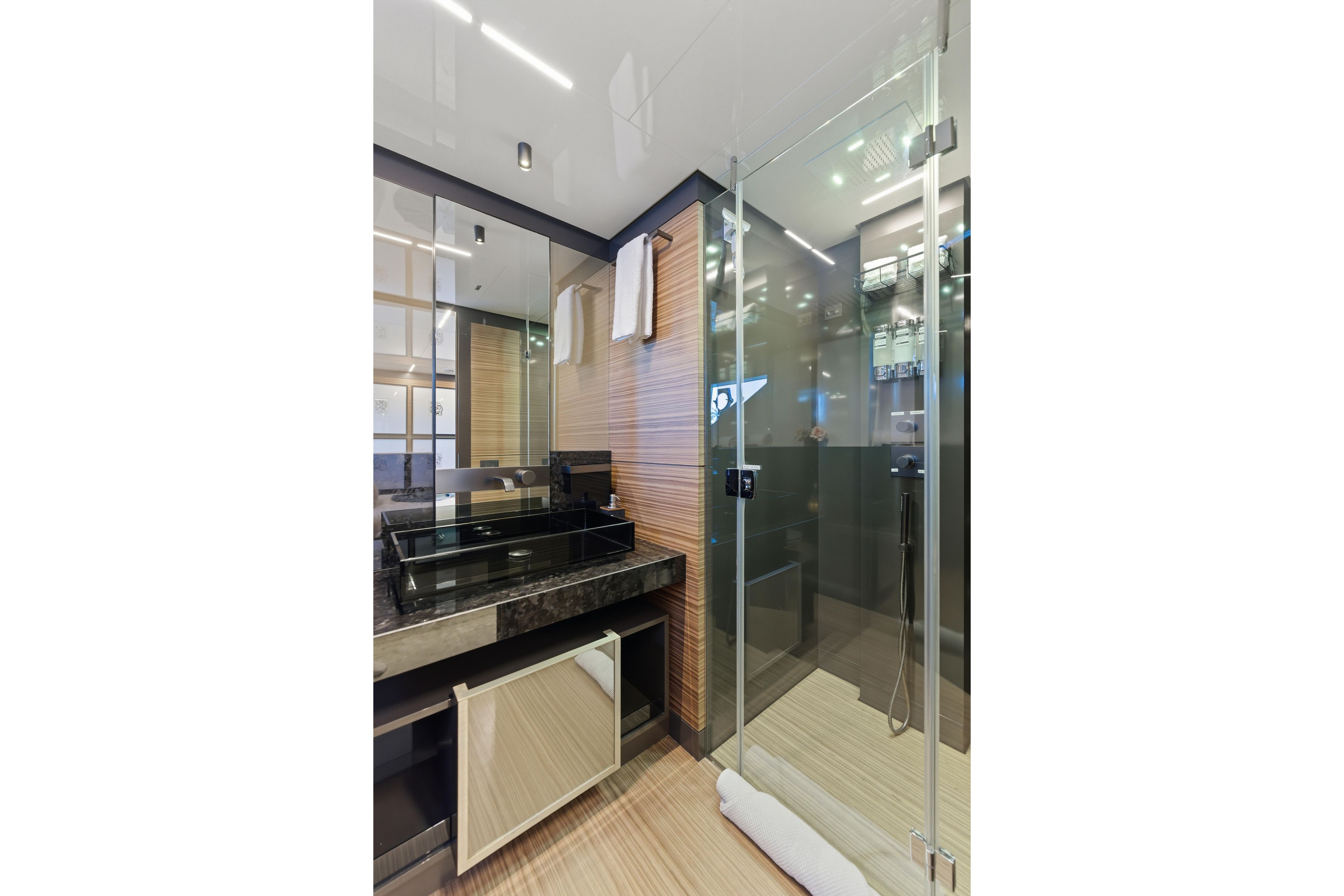 Luxurious bathroom in 2018 Ferretti Yachts 920, featuring modern glass shower and sleek design.