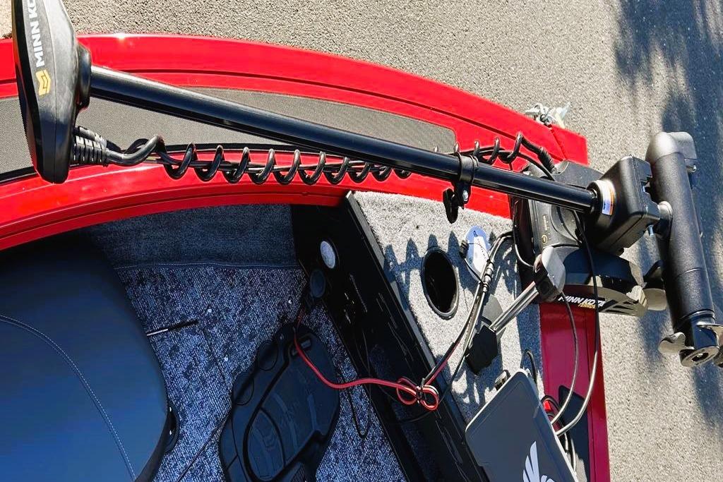 2026 Tracker Targa V-19 Combo boat with Minn Kota trolling motor, red and gray interior.