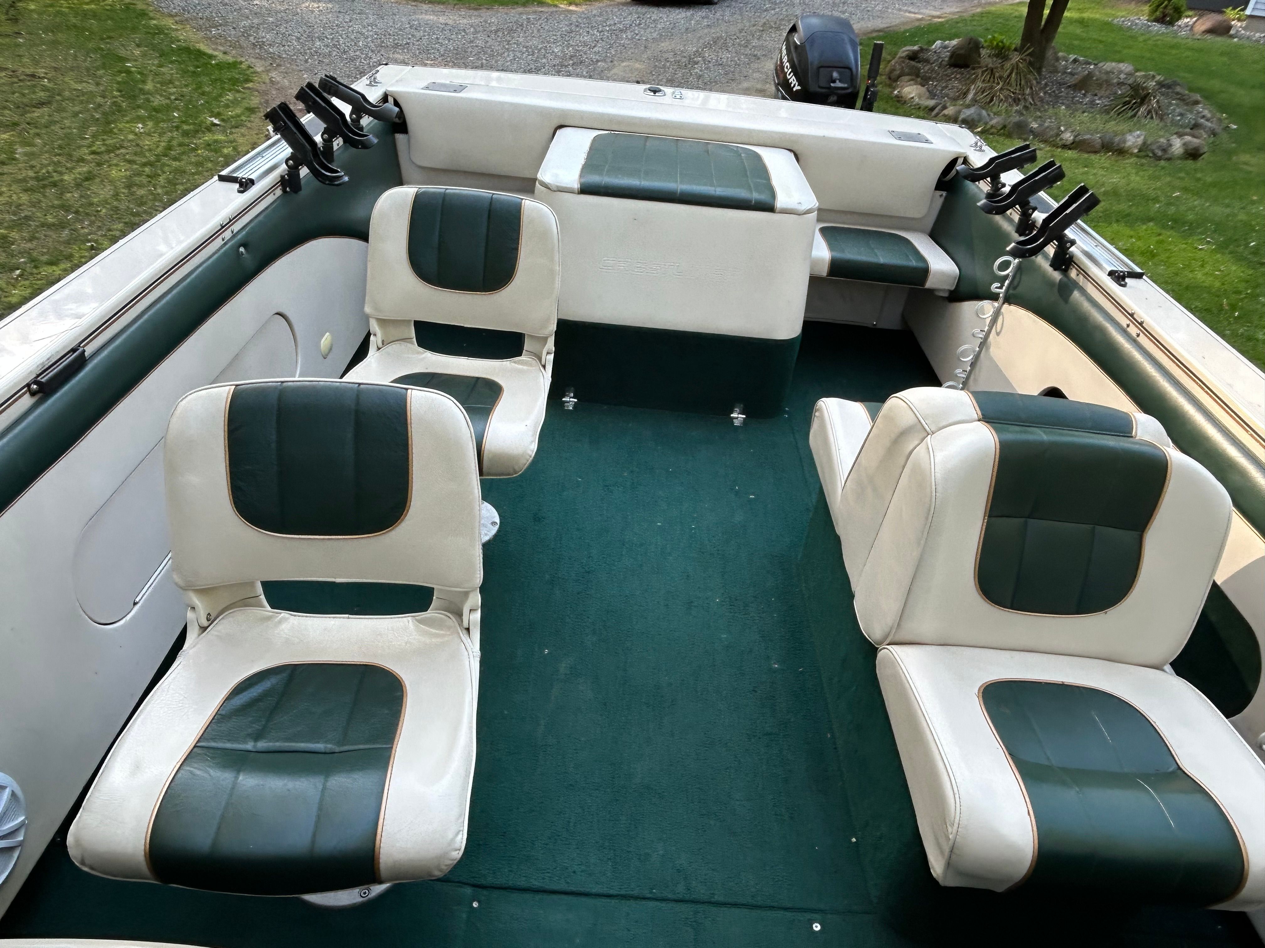Interior of a 1997 Crestliner 2050 Sportfish boat with green seating.
