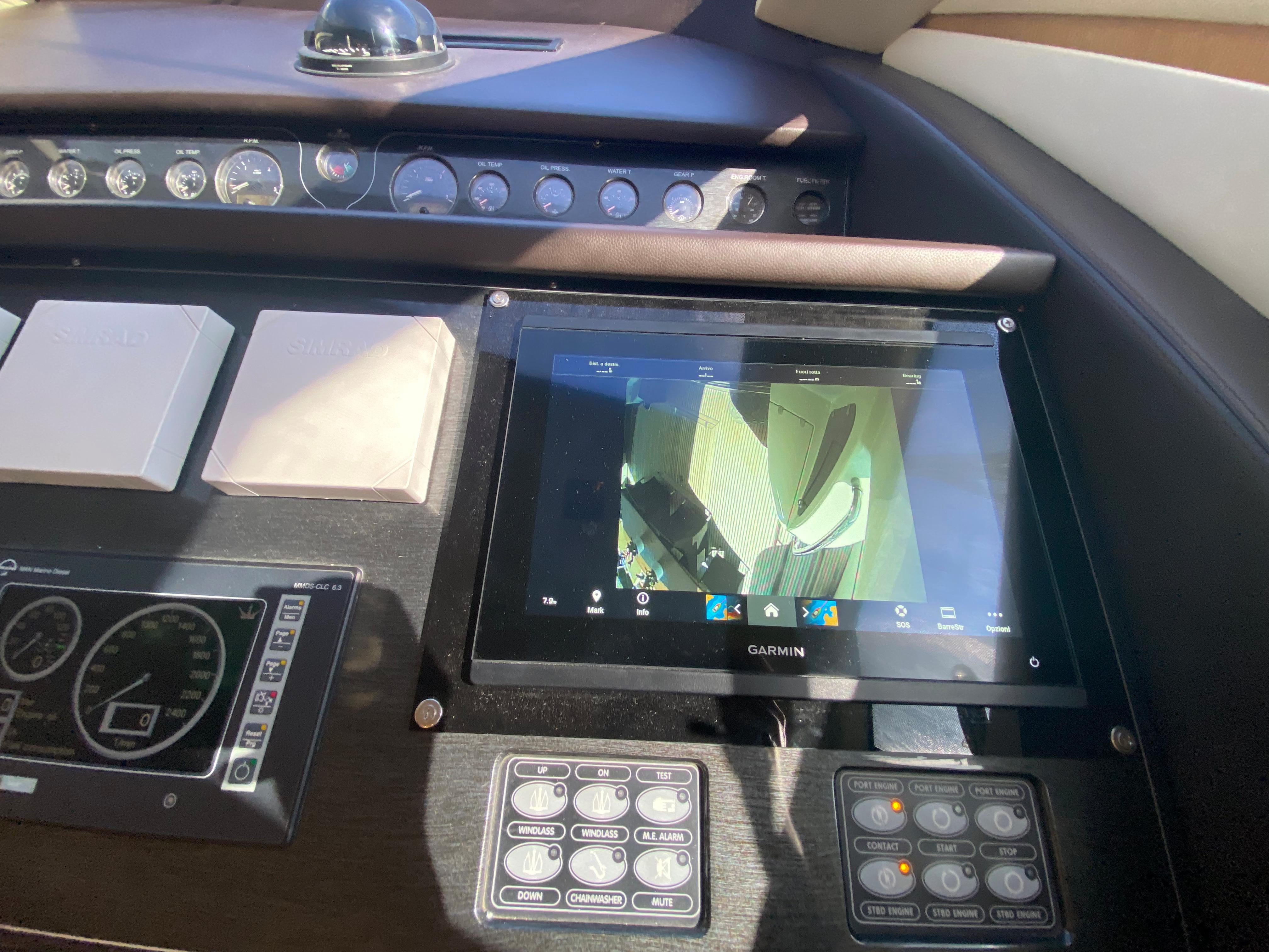 Control panel of 2008 Dominator 680 yacht with Garmin display and gauges.