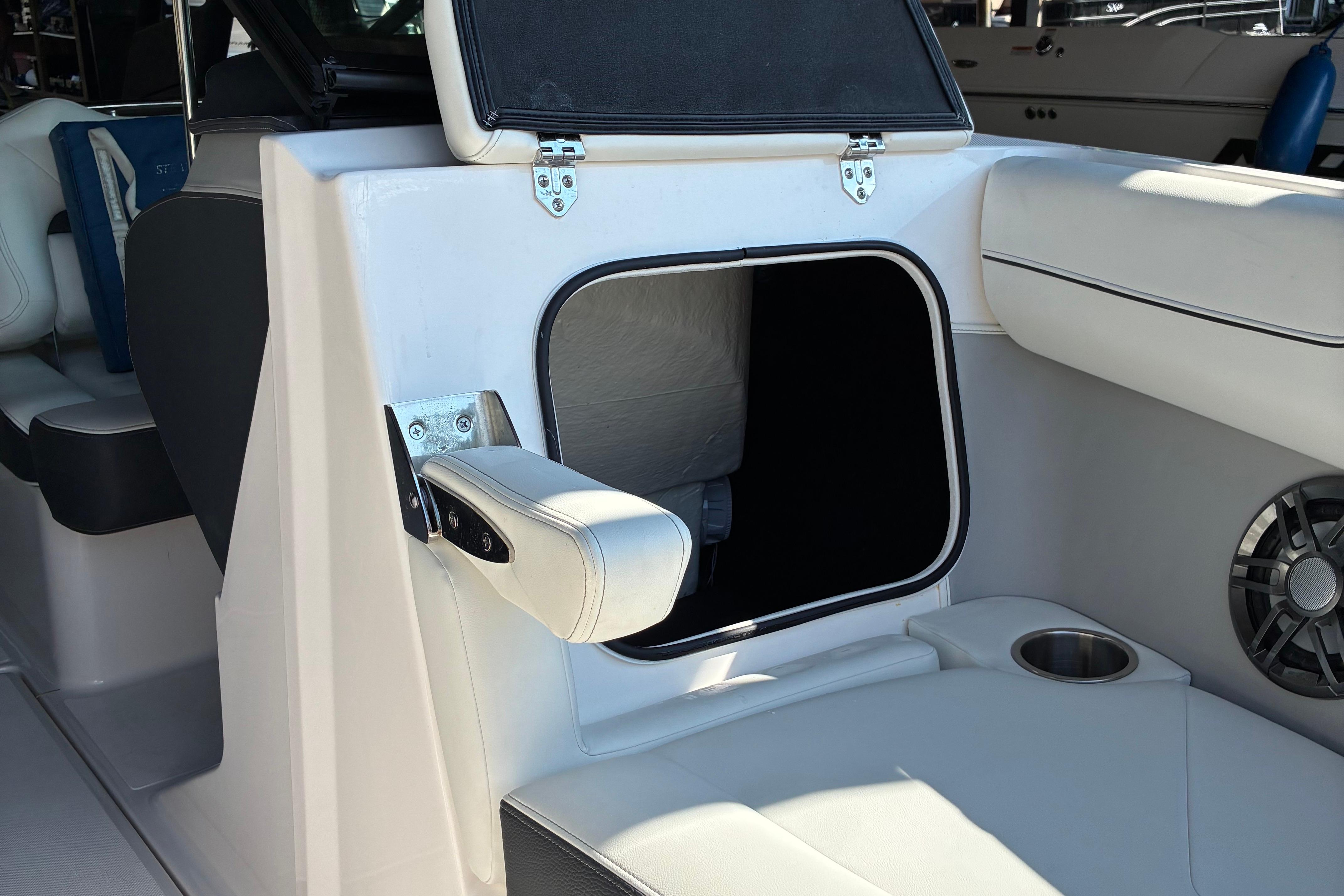 2025 Regal LS2 boat interior with open storage compartment and speaker.