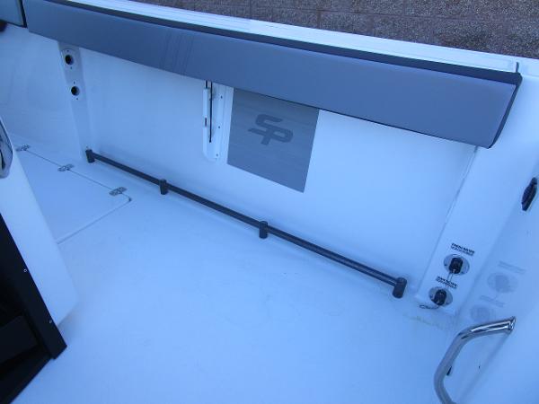 2025 Sea Pro 292 Offshore boat interior with storage and control panel.