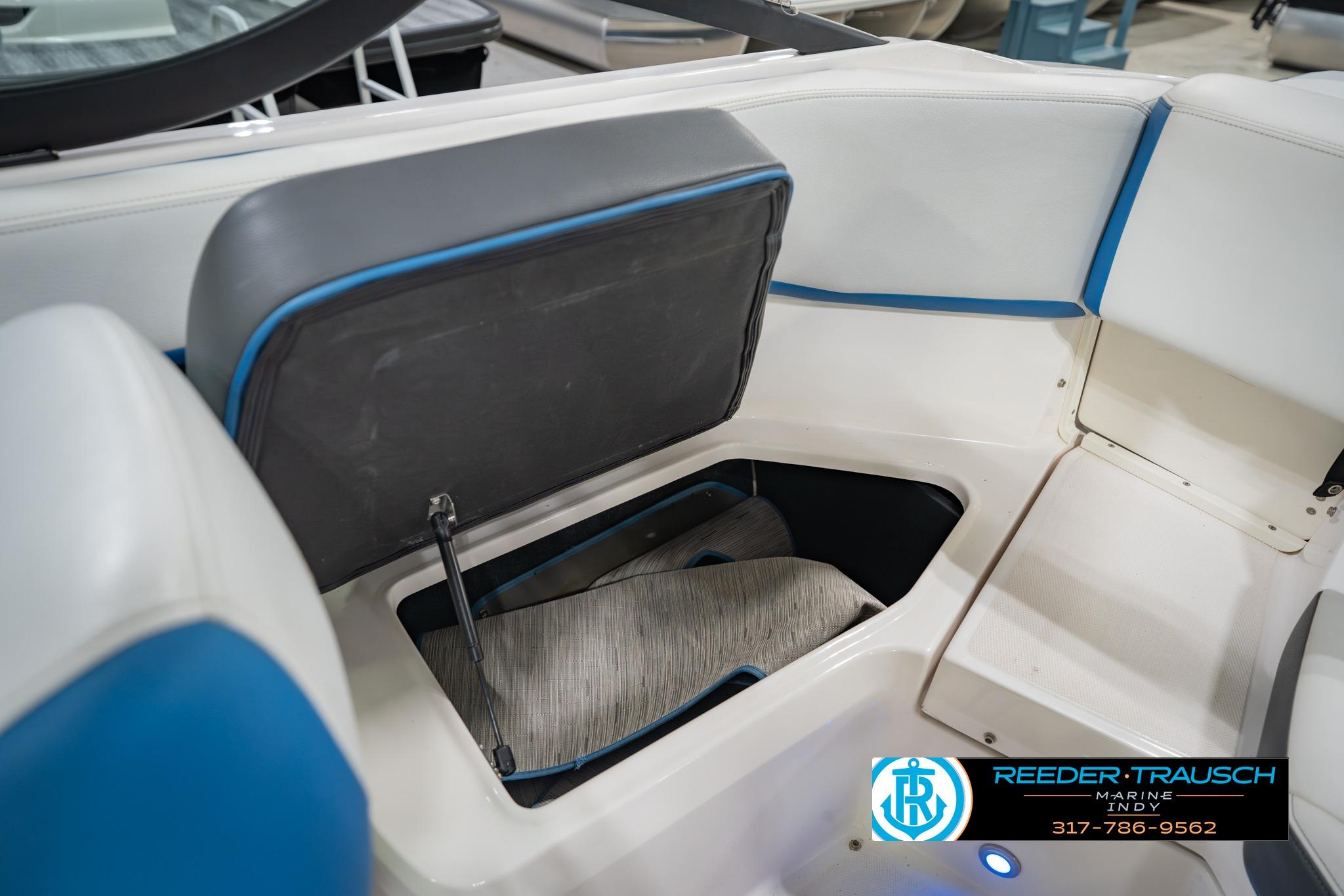 2015 Regal 2000 ESX Bowrider interior storage compartment with blue accents.